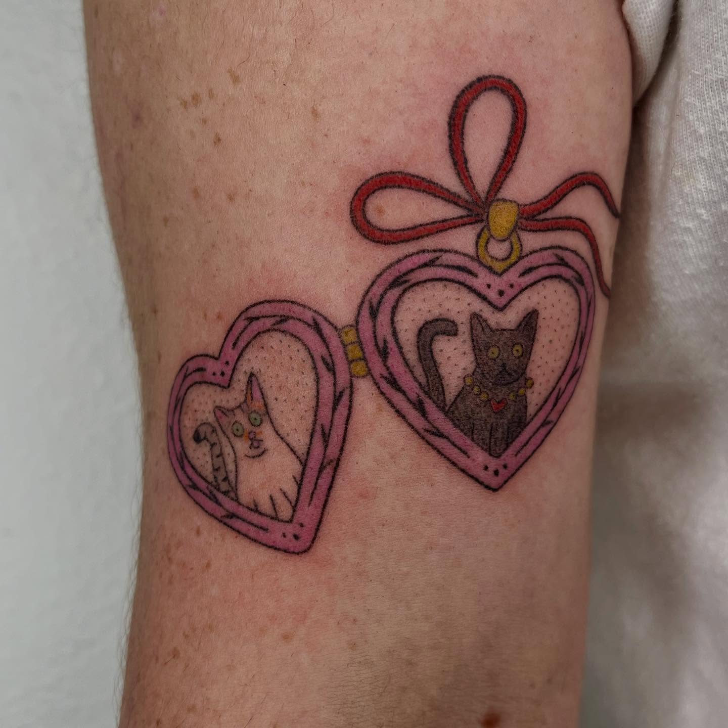 Heart-shaped lockets dotwork tattoo on the forearm by Jenna