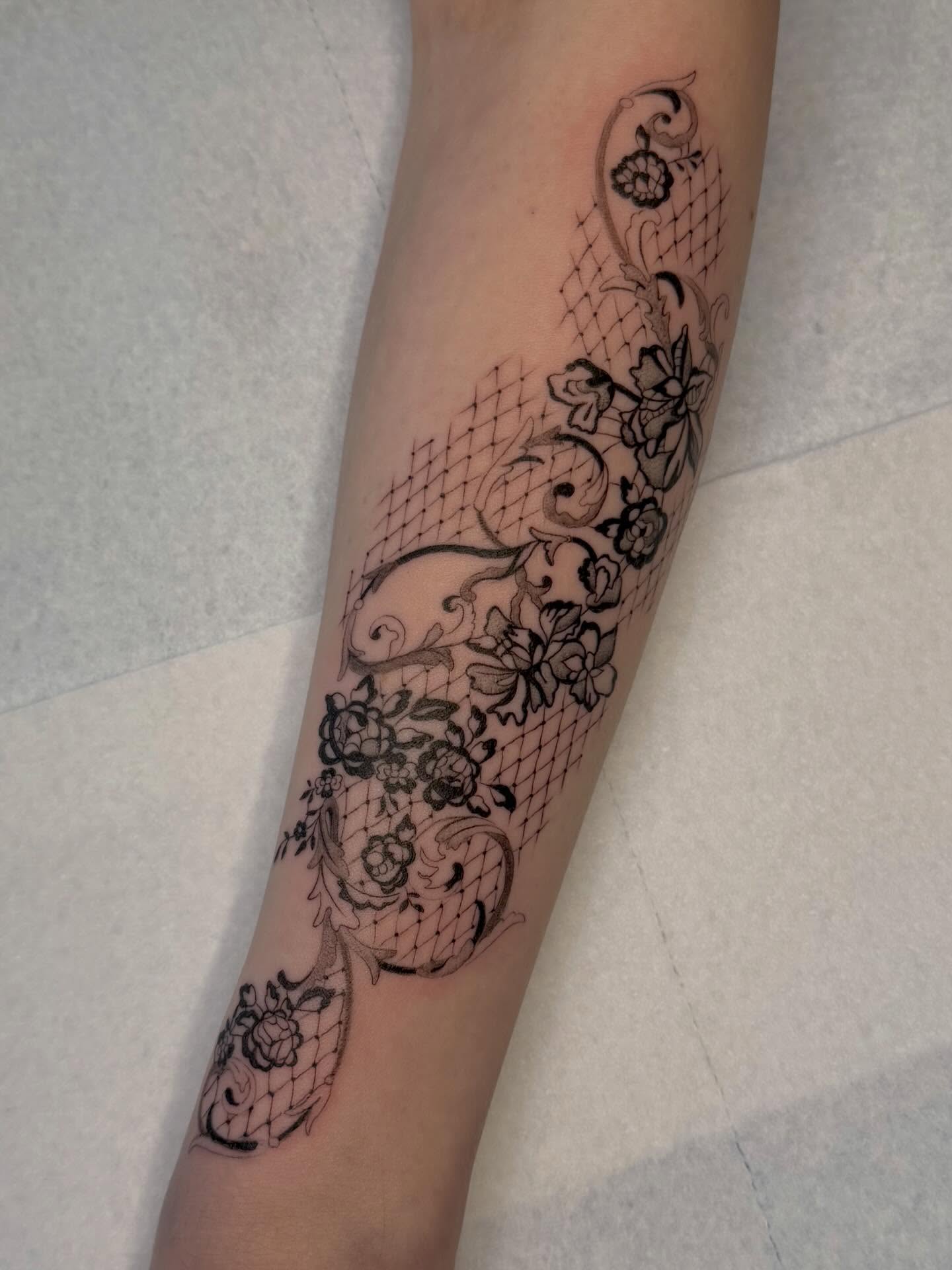 Lace pattern black and grey tattoo on the forearm by Nayoung, San Francisco, California
