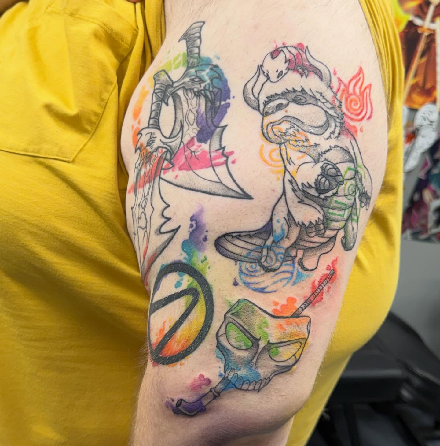Warrior and sword watercolor tattoo on the upper arm by Katie Rojas