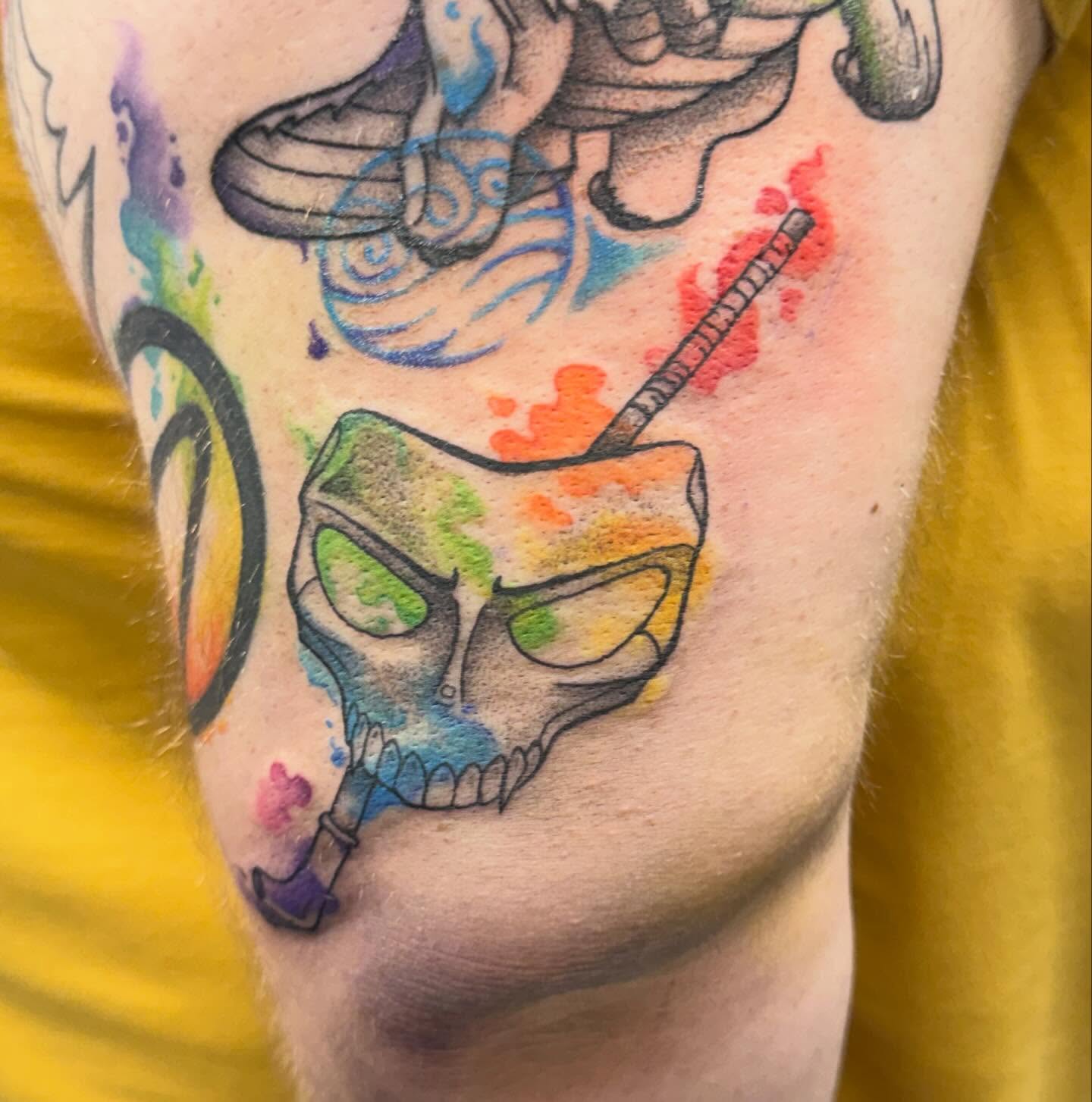 Skull with sunglasses watercolor tattoo on the forearm by Katie Rojas