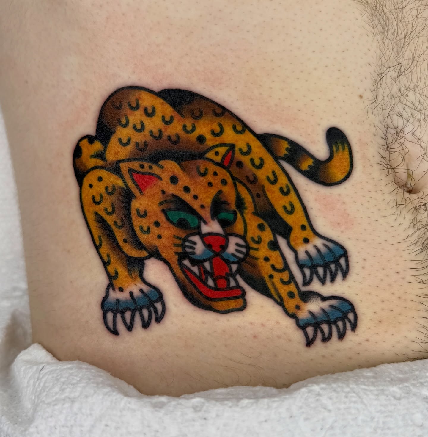 Leopard American traditional tattoo on the thigh by لا Kenny McCabe لا