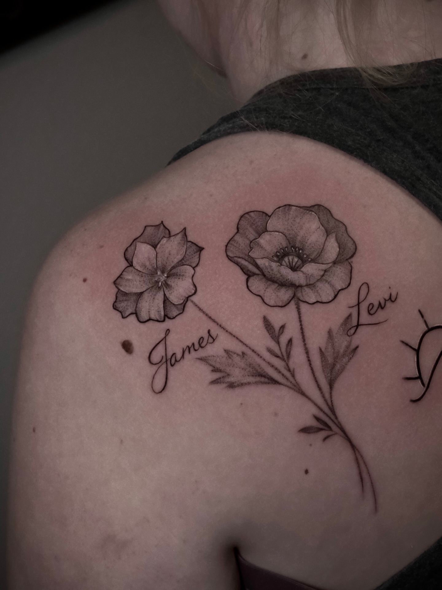 Flowers and names black and grey tattoo on the shoulder by AL 777, Denton, Texas
