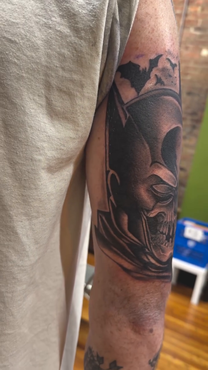 Batman skull realism tattoo on the forearm by Duff McCormack