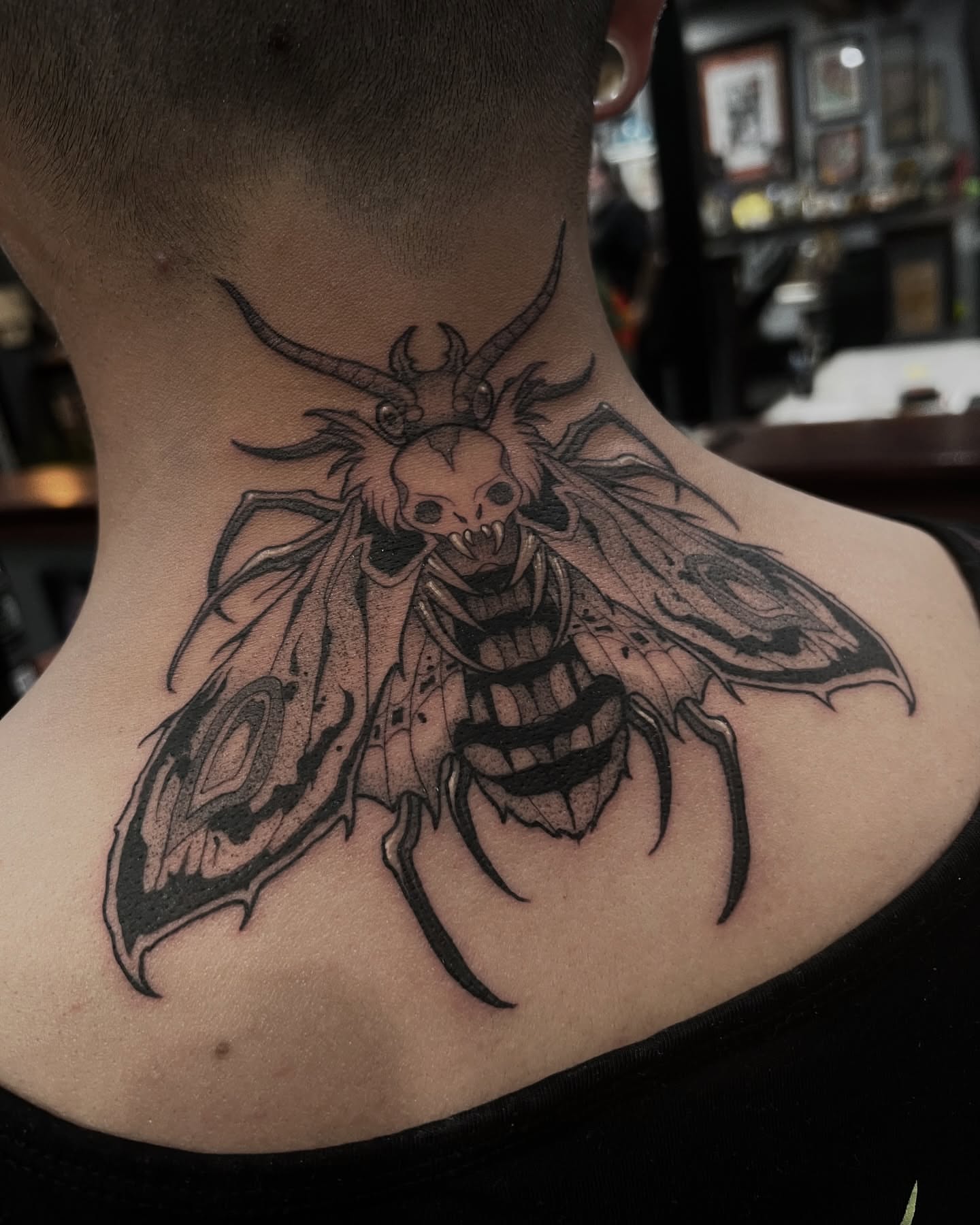 Moth dark realism tattoo on the neck by Las Vegas Tattoo Artist