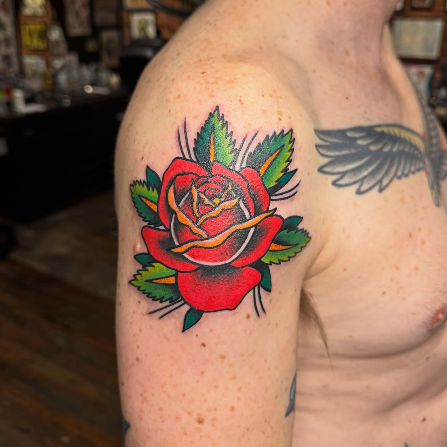 Red rose American traditional tattoo on the shoulder by kenneth nash