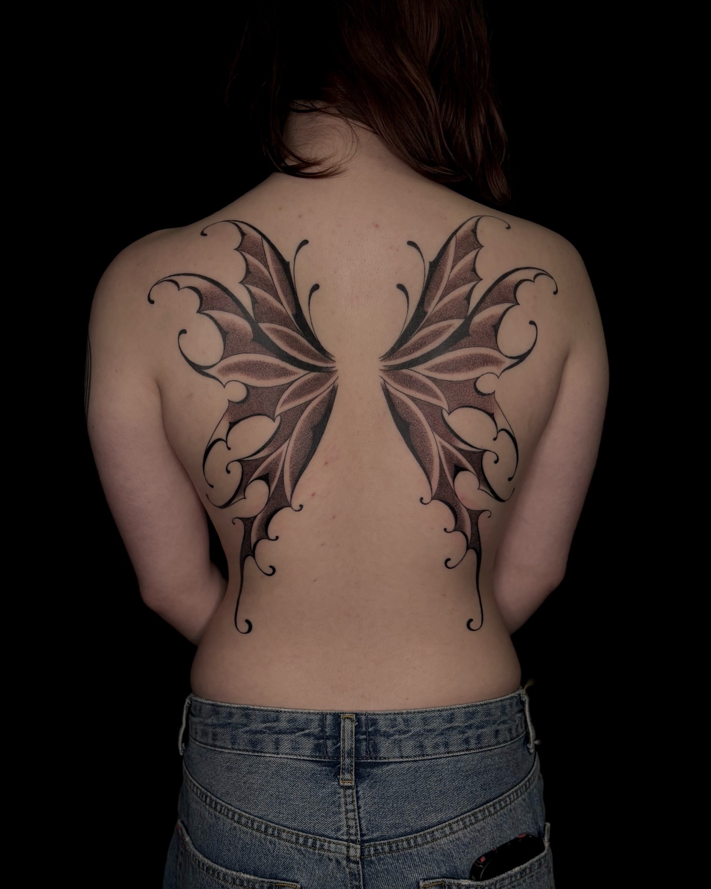 Wing dotwork tattoo on the back by Tattoo Artist, in San Francisco, CA