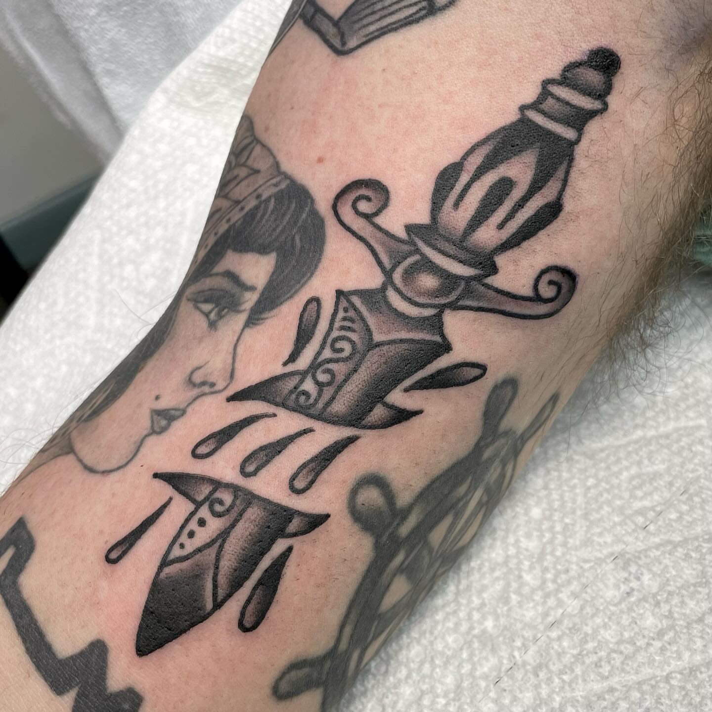 Knife and woman black and grey tattoo on the forearm by 𝐒𝐚𝐦𝐬𝐨𝐧𝐋𝐚𝐳𝐚𝐫𝐭𝐞