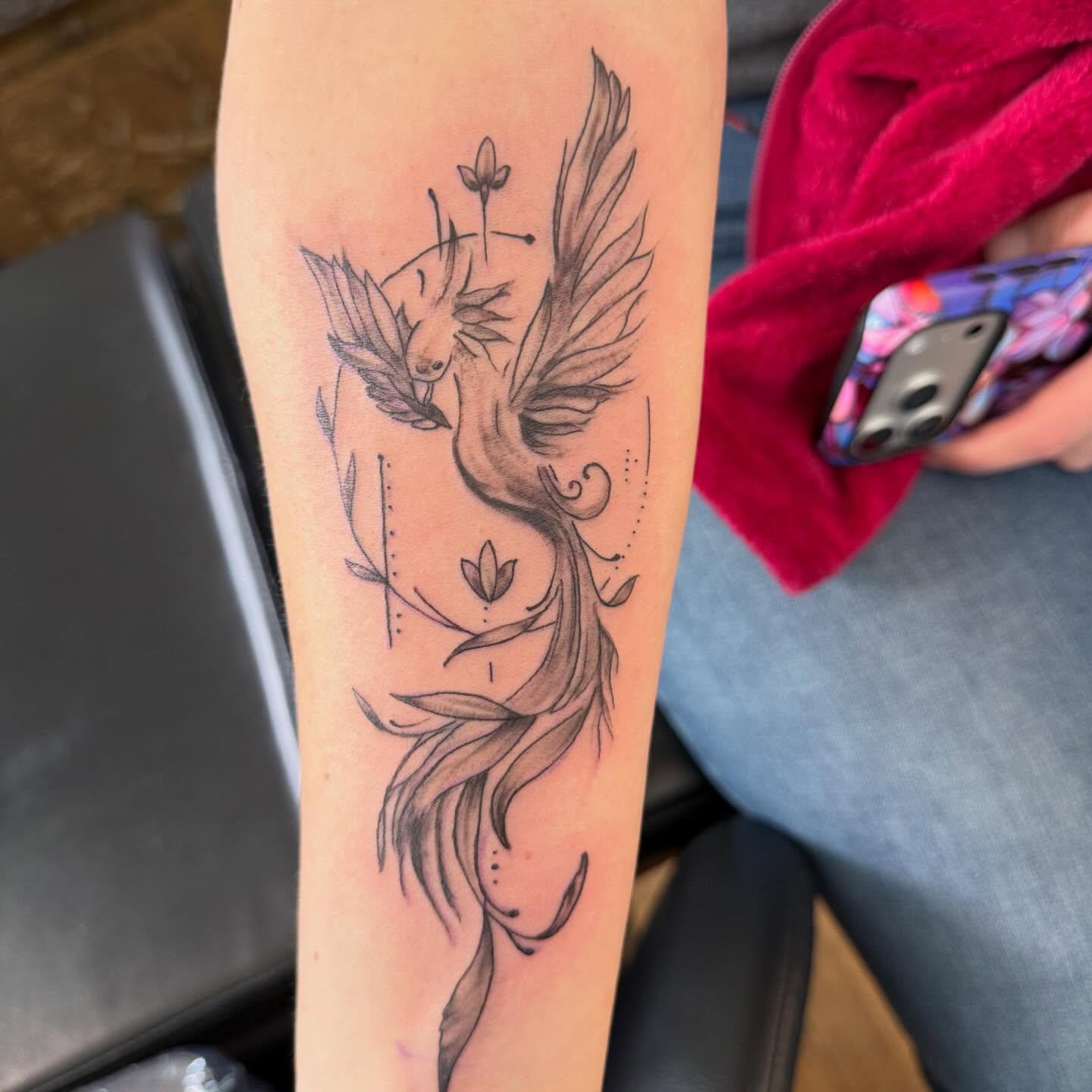 Phoenix black and grey tattoo on the forearm by Jillian Pardy