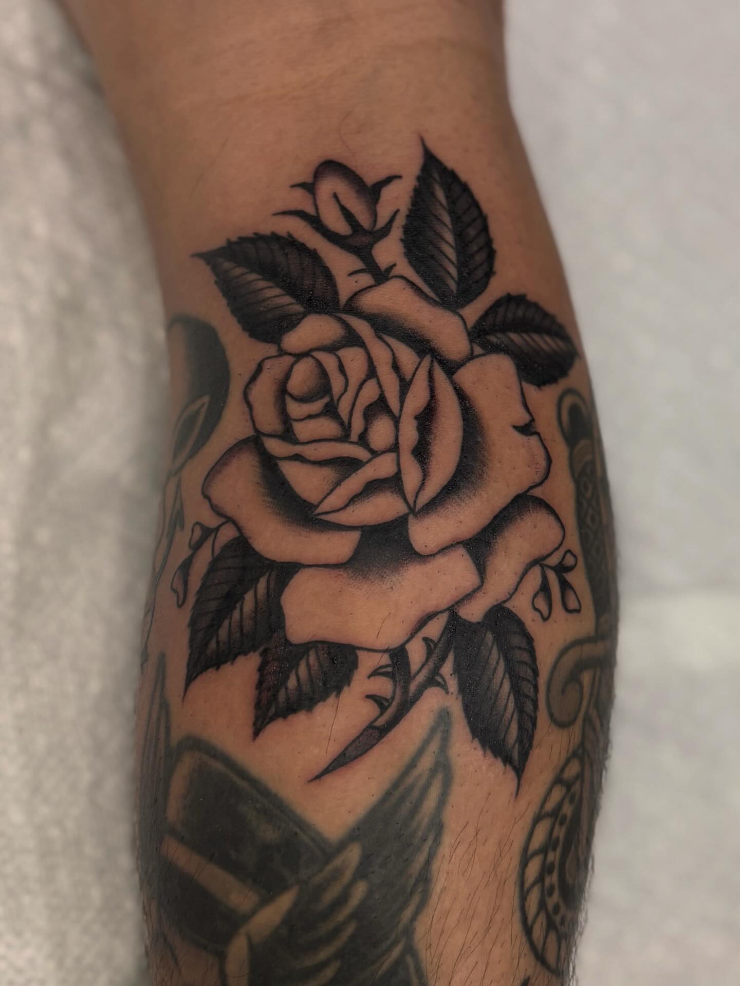 Rose black and grey tattoo on the forearm by Jesse Smith, Chicago, Illinois