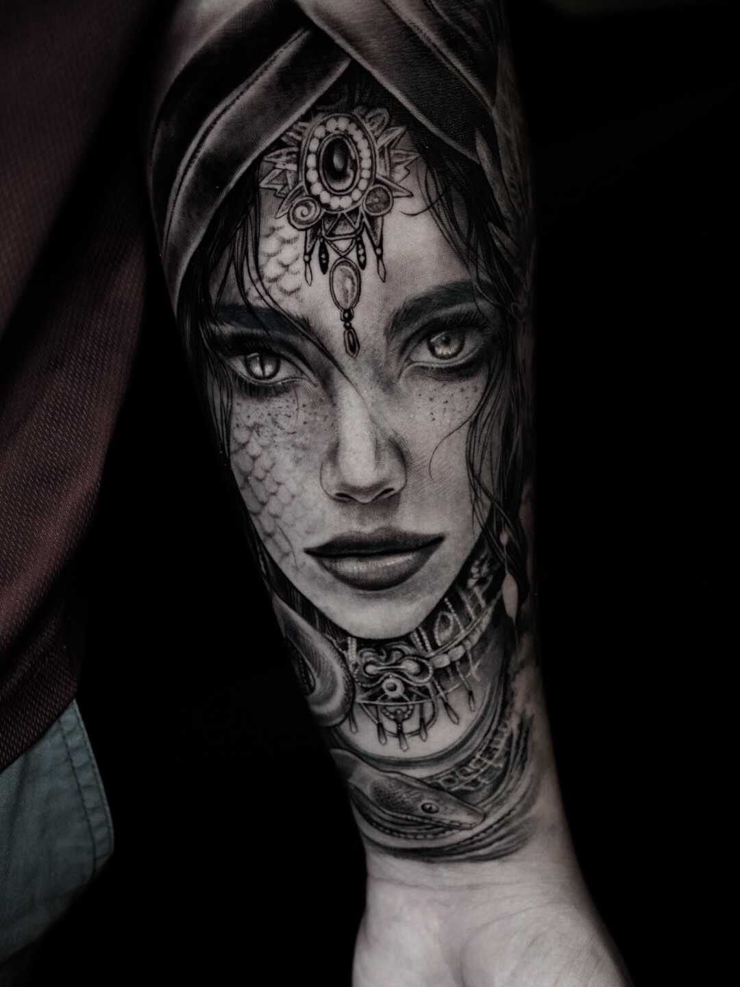 Woman with intricate headpiece realism tattoo on the head by Elisha Kane