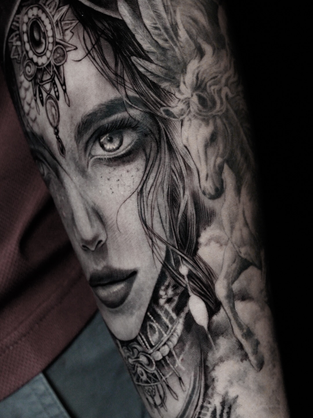 Portrait realism tattoo on the forearm by Elisha Kane