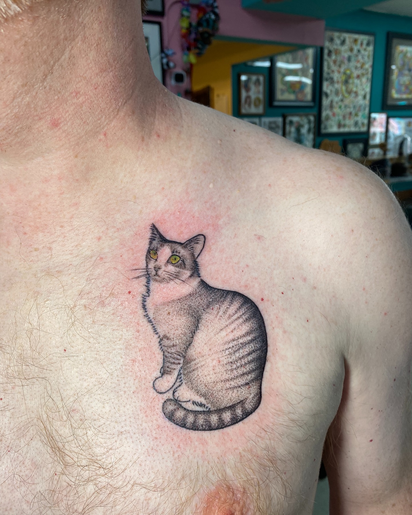 Cat dotwork tattoo on the chest by Ramsie Segura-Andrews