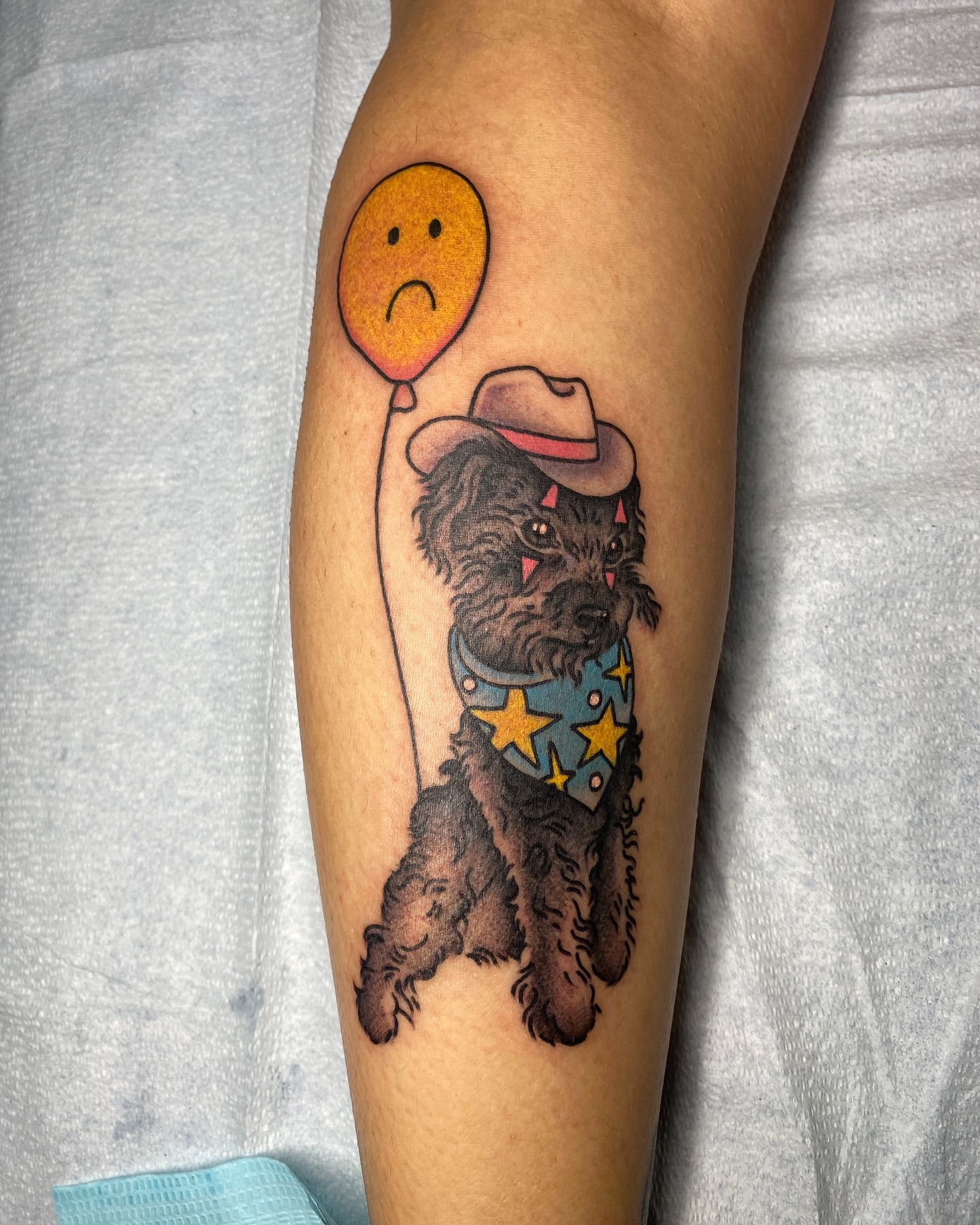 Dog wearing cowboy hat realism tattoo on the forearm by Ramsie Segura-Andrews