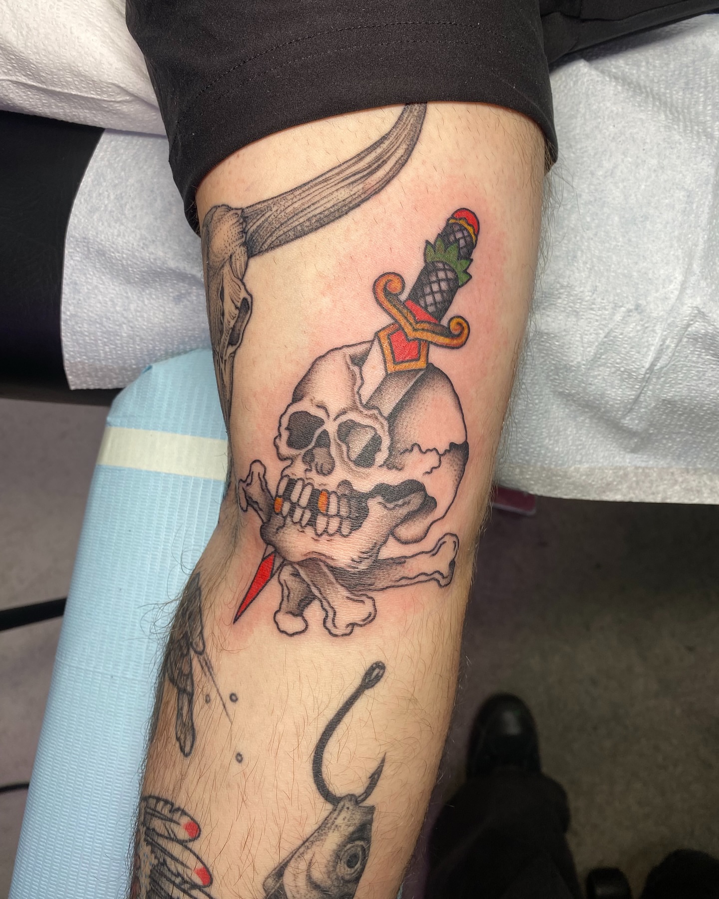 Skull with dagger American traditional tattoo on the forearm by Ramsie Segura-Andrews