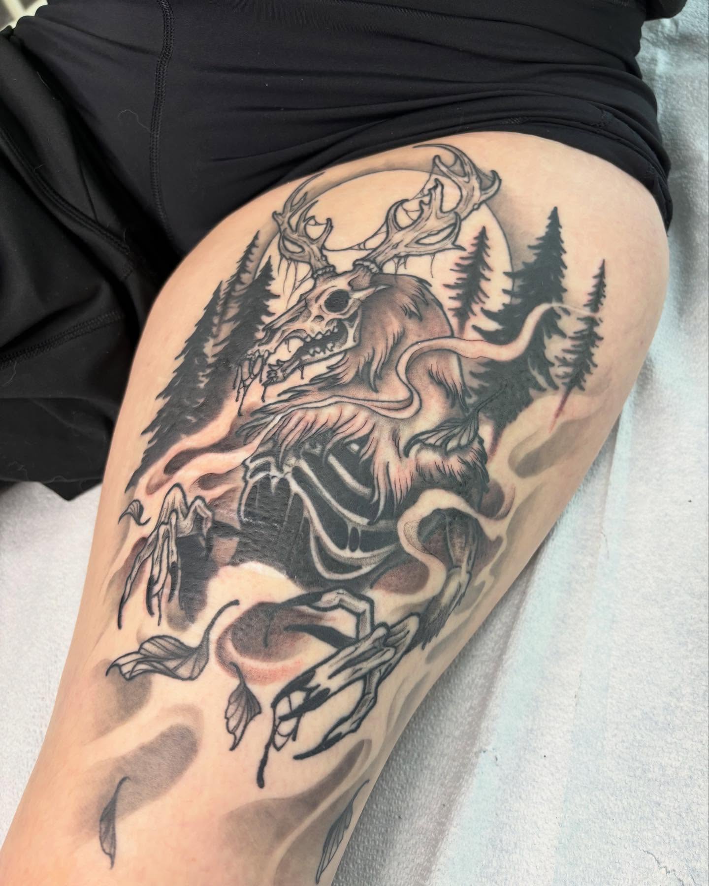 Deer skull black and grey tattoo on the thigh by Riley Borne