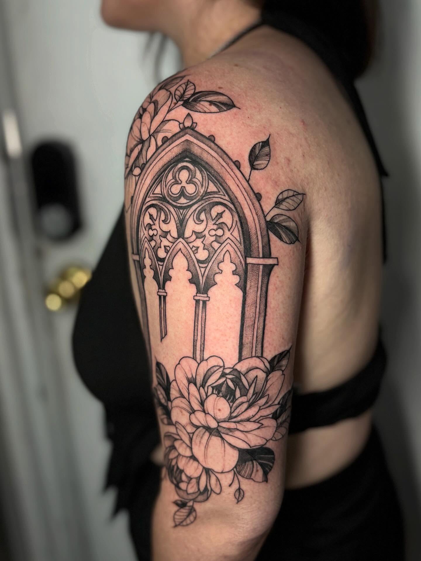 Gothic window and flowers ornamental tattoo on the shoulder by Tattoos by Tessa