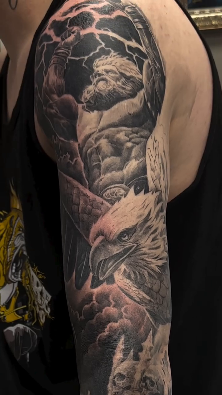 Eagle and clouds realism tattoo by Matthew Doherty