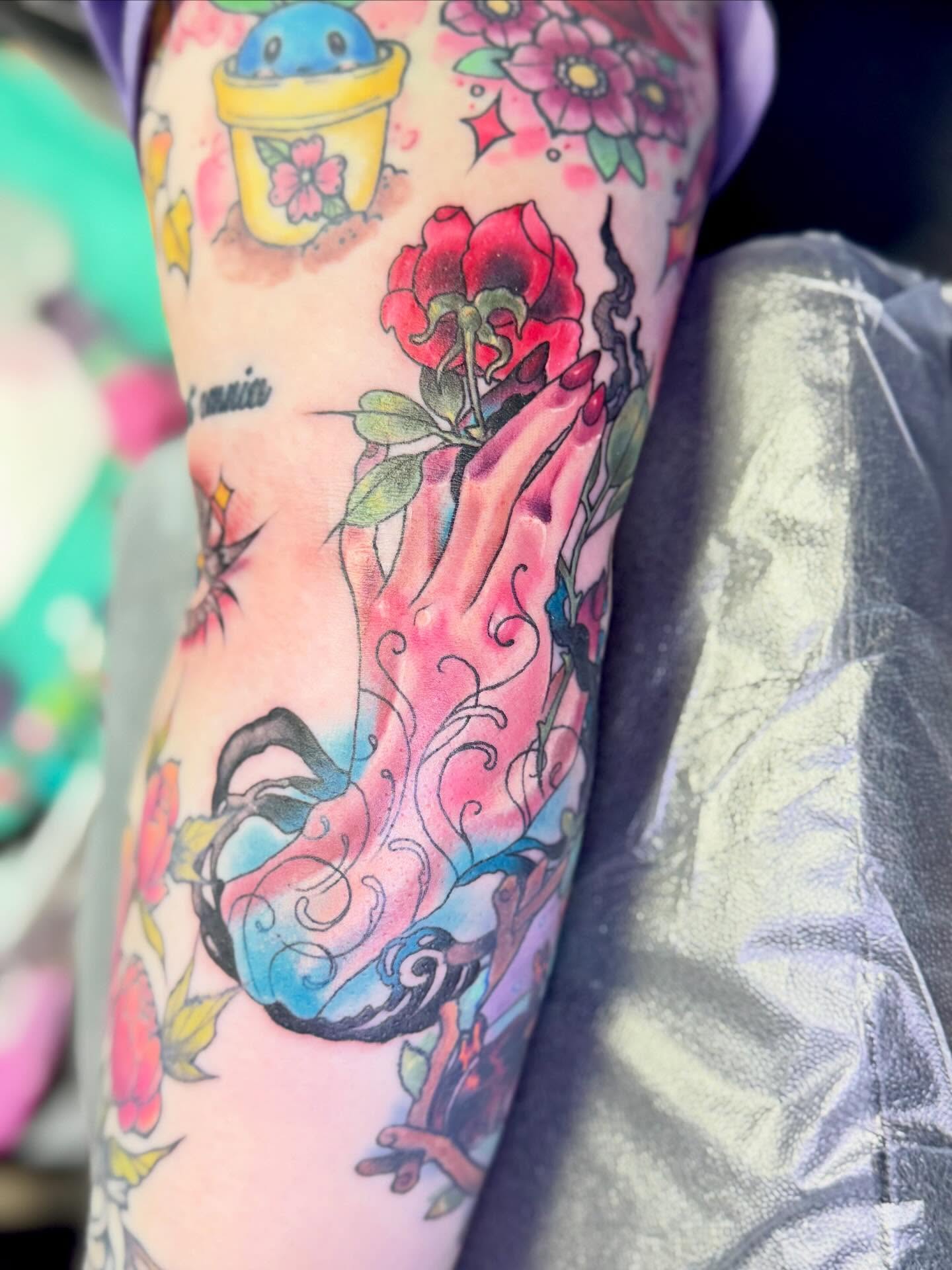 Praying hands with flowers American traditional tattoo on the forearm by Eileen Joyce