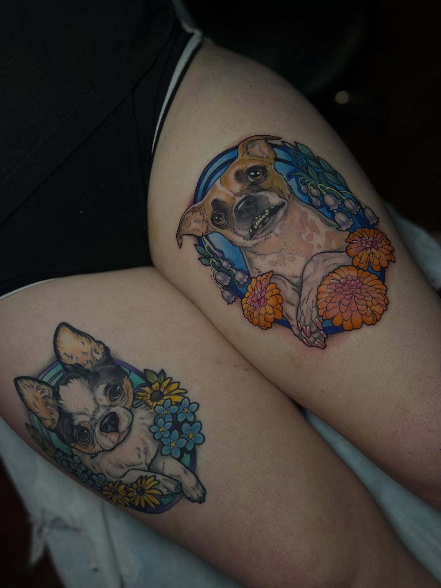 Dogs with floral wreaths realism tattoo on the thigh by Jen Love