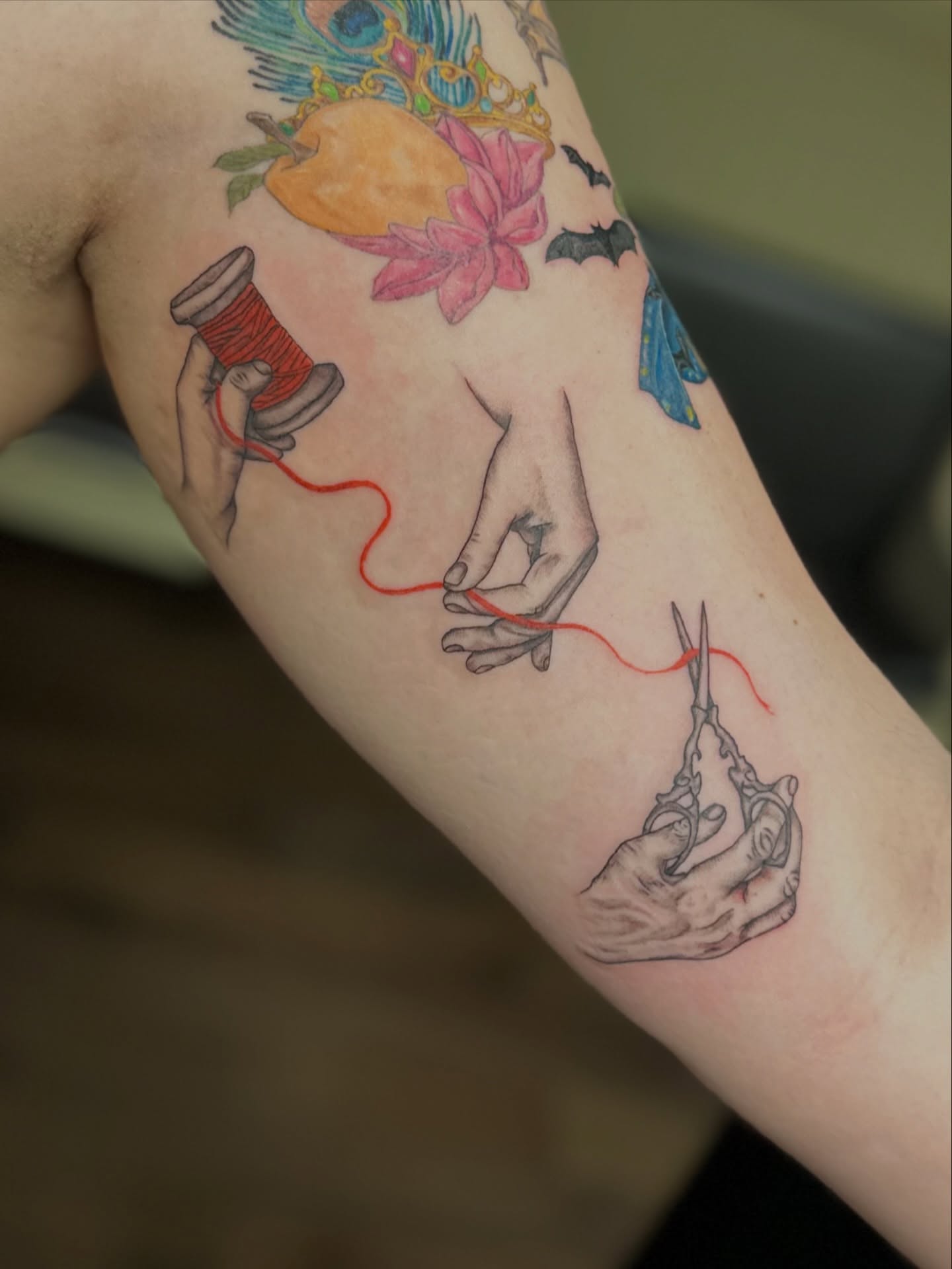 Sewing theme new school tattoo on the forearm by Ransom