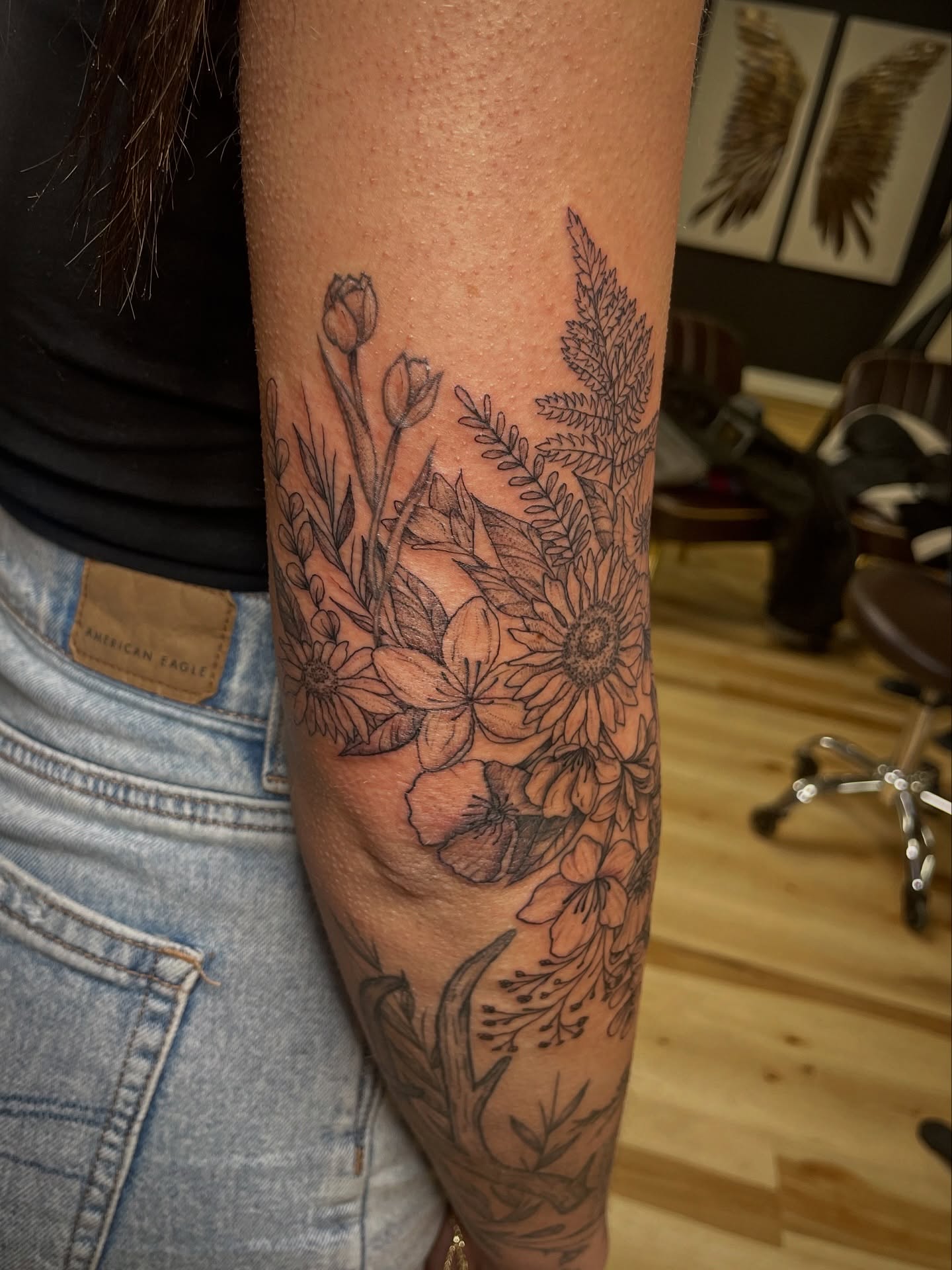 Floral bouquet black and grey tattoo on the forearm by Francesca Siwa