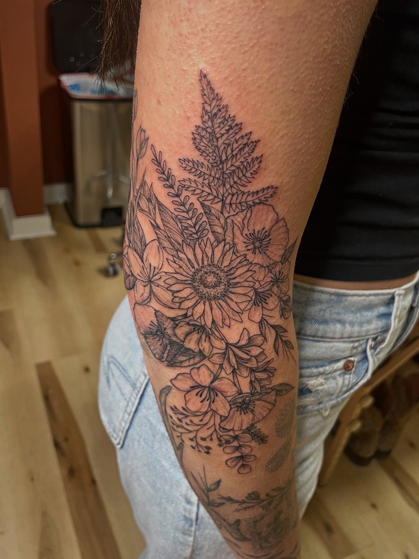 Floral bouquet black and grey tattoo on the forearm by Francesca Siwa
