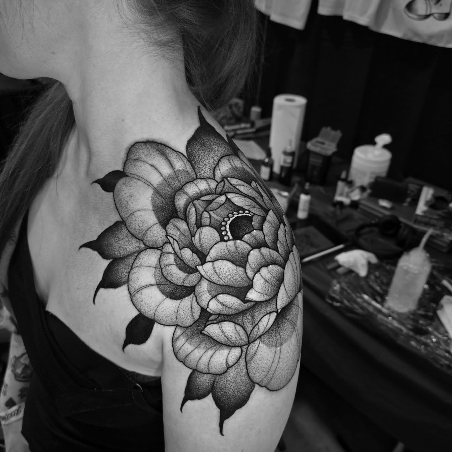 Flower dotwork tattoo on the shoulder by Justin Eldridge