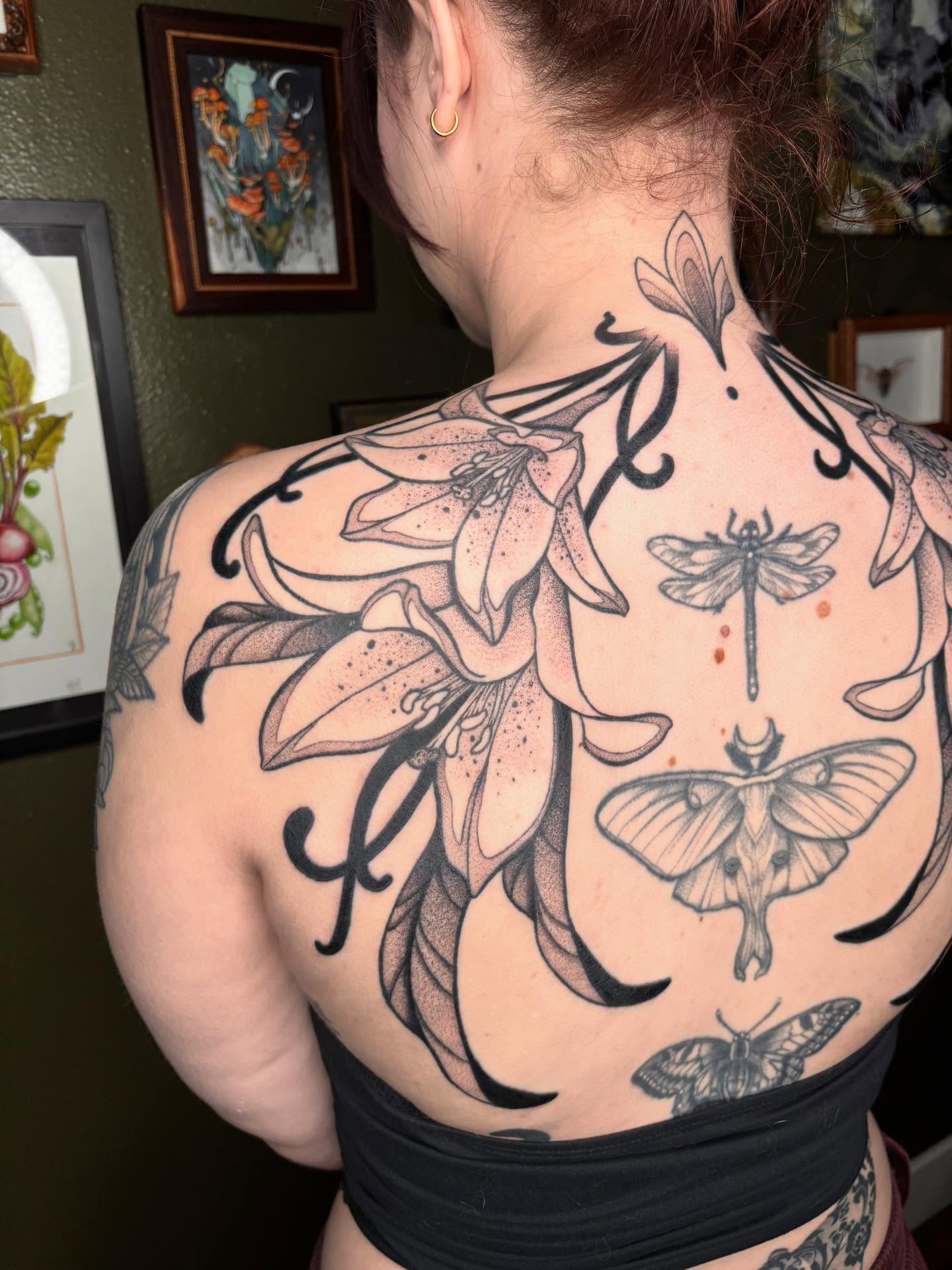 Lilies and insects dotwork tattoo on the back by Wren Hollow, Portland, Oregon