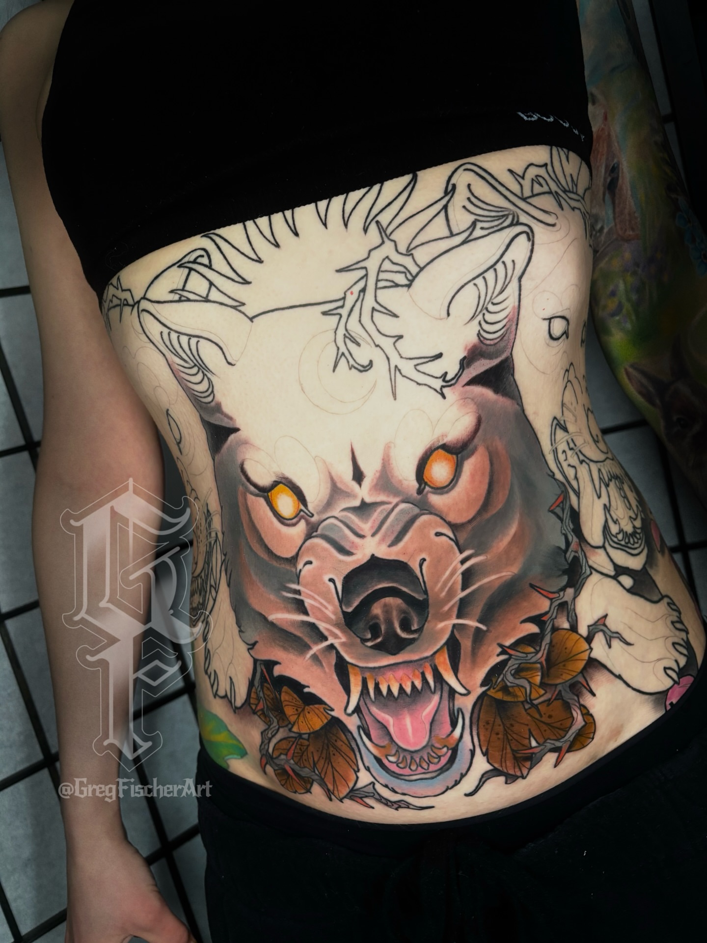 Angry bear American traditional tattoo on the ribs by Greg Fischer