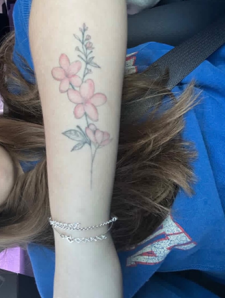Flowers realism tattoo on the forearm by Chloe