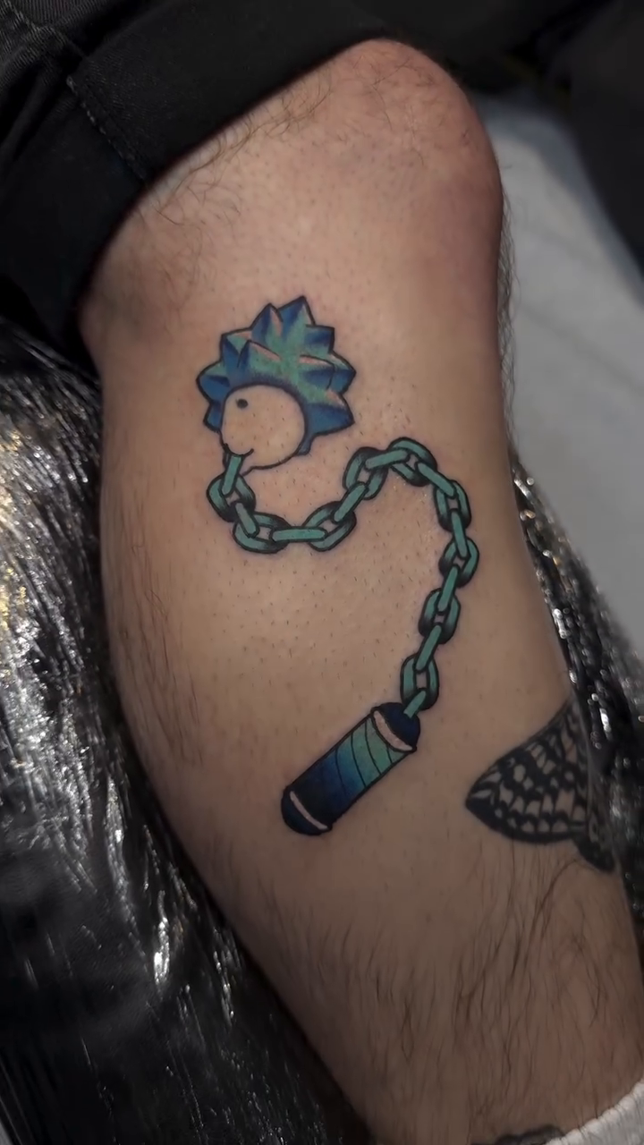 Rick Sanchez with nunchucks new school tattoo on the forearm by Mercy Dean