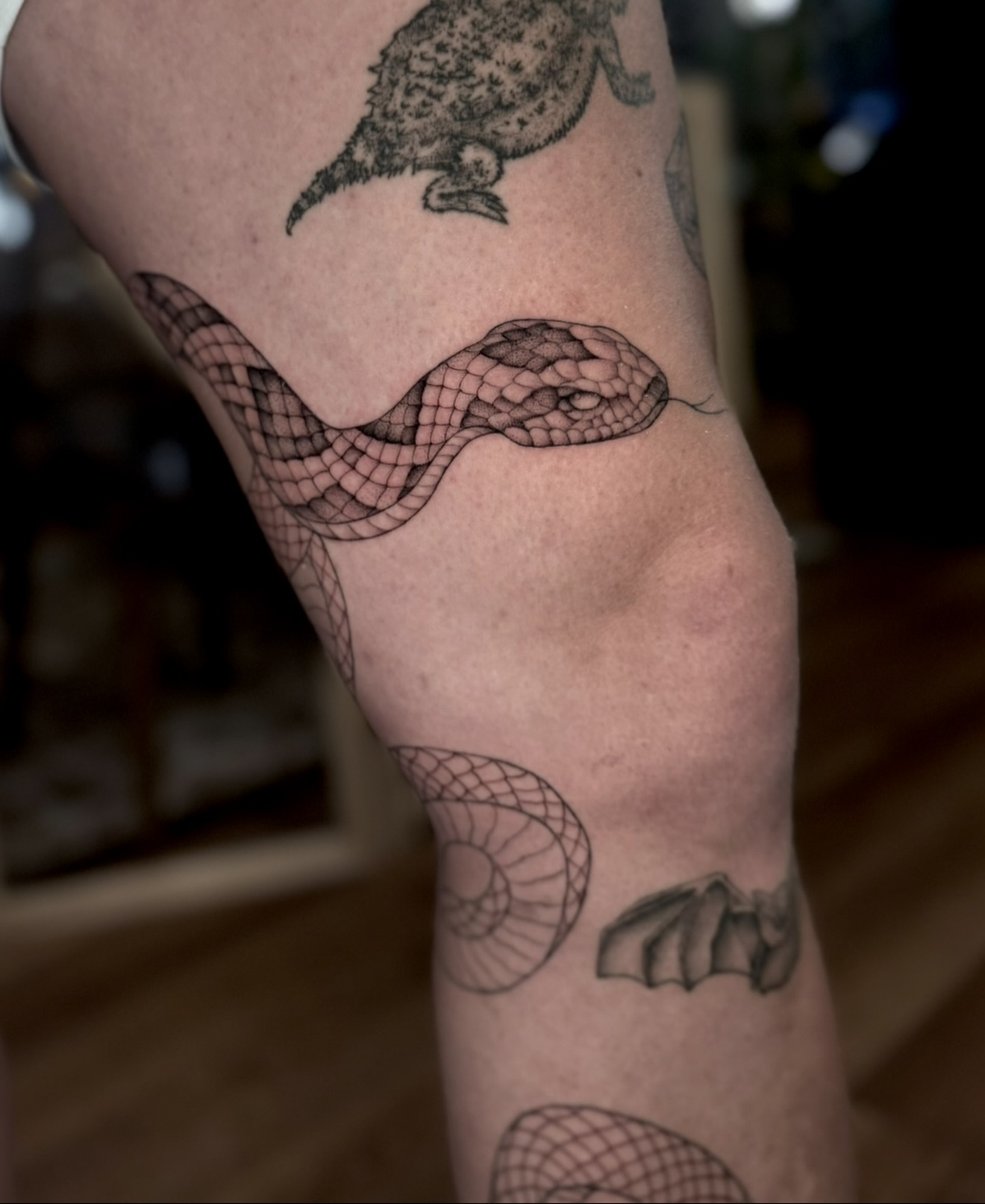 Snake geometric tattoo on the forearm by Kathryn Semus