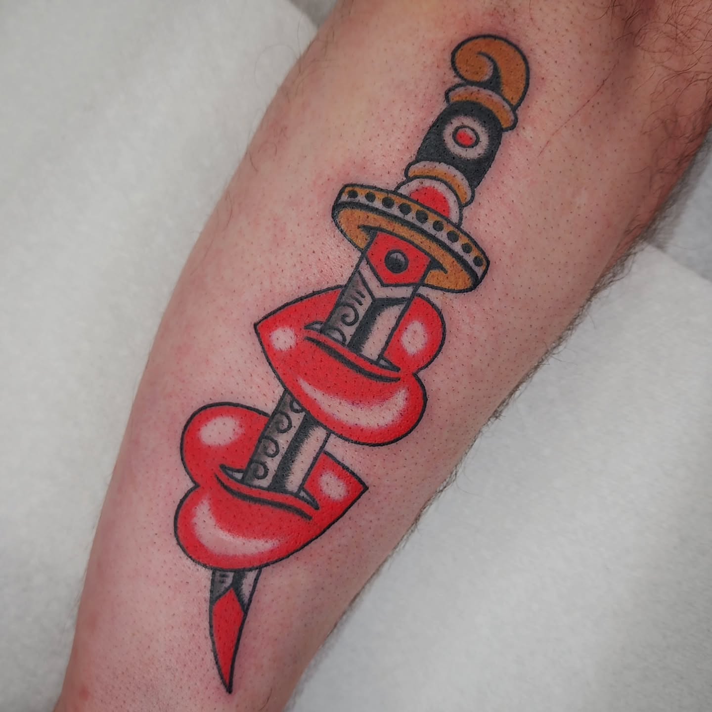 Sword American traditional tattoo on the forearm by 𝘈𝘋𝘈𝘔 𝘉𝘈𝘙𝘕𝘌𝘚