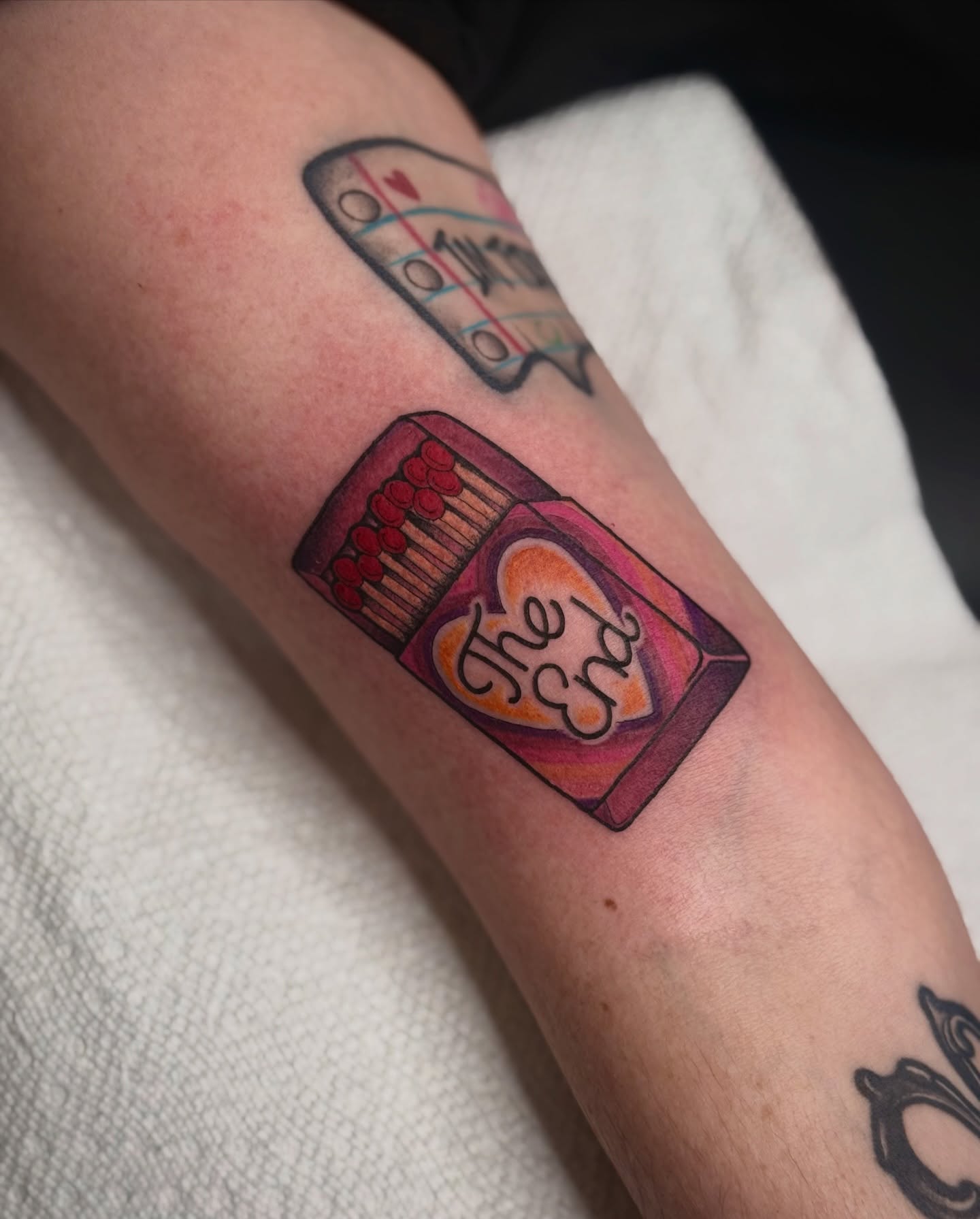 Matchbox dotwork tattoo on the forearm by K9