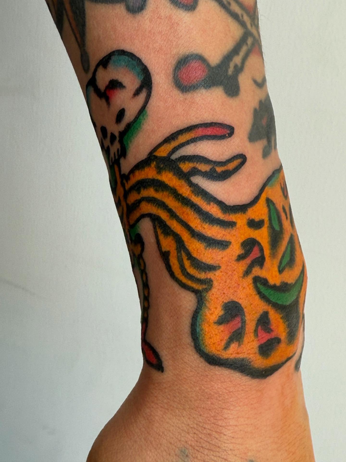 Tiger American traditional tattoo on the forearm by JAX