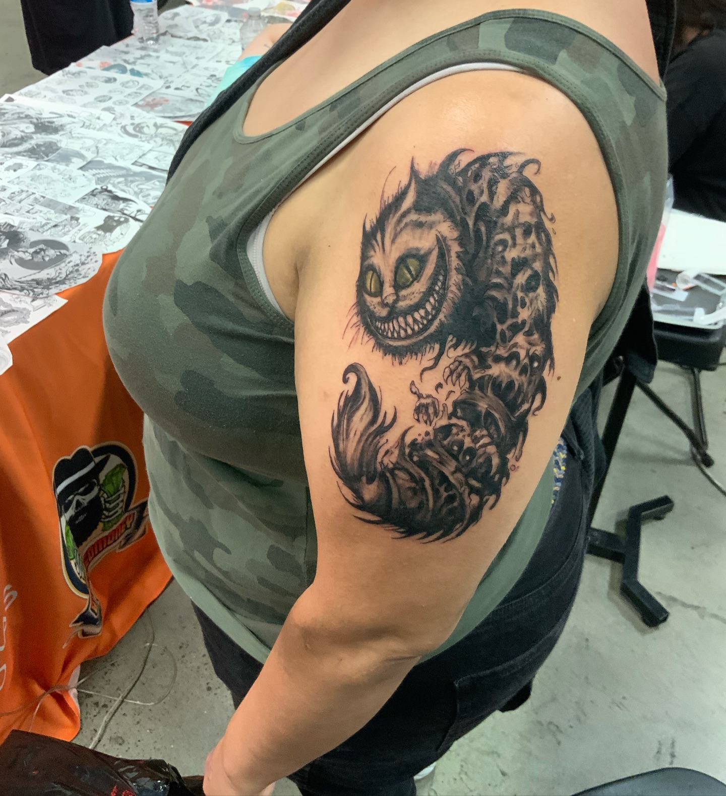 Cheshire cat realism tattoo on the shoulder by Daniel Illachek