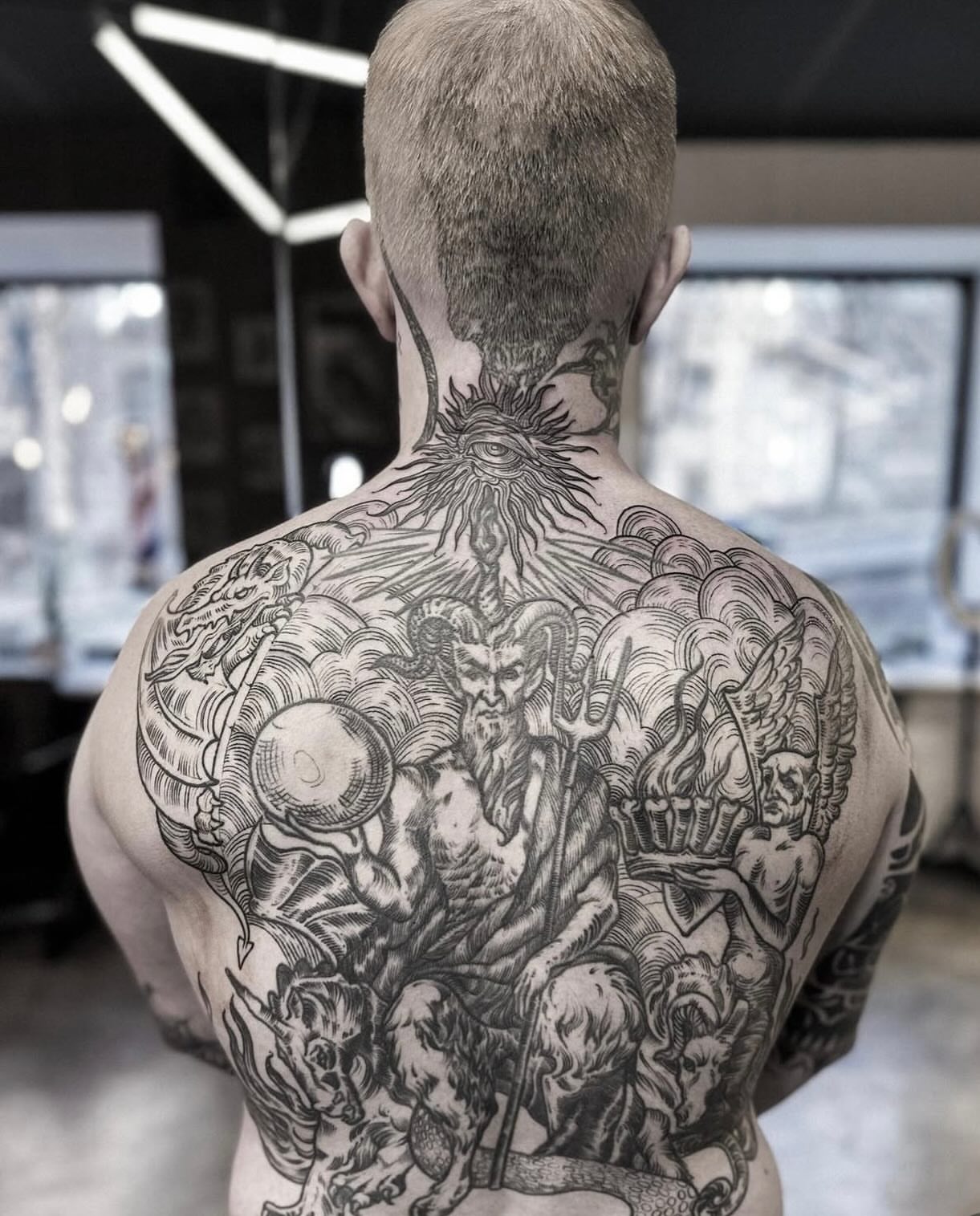 Mythical creature realism tattoo on the back by Elvira Savchuk