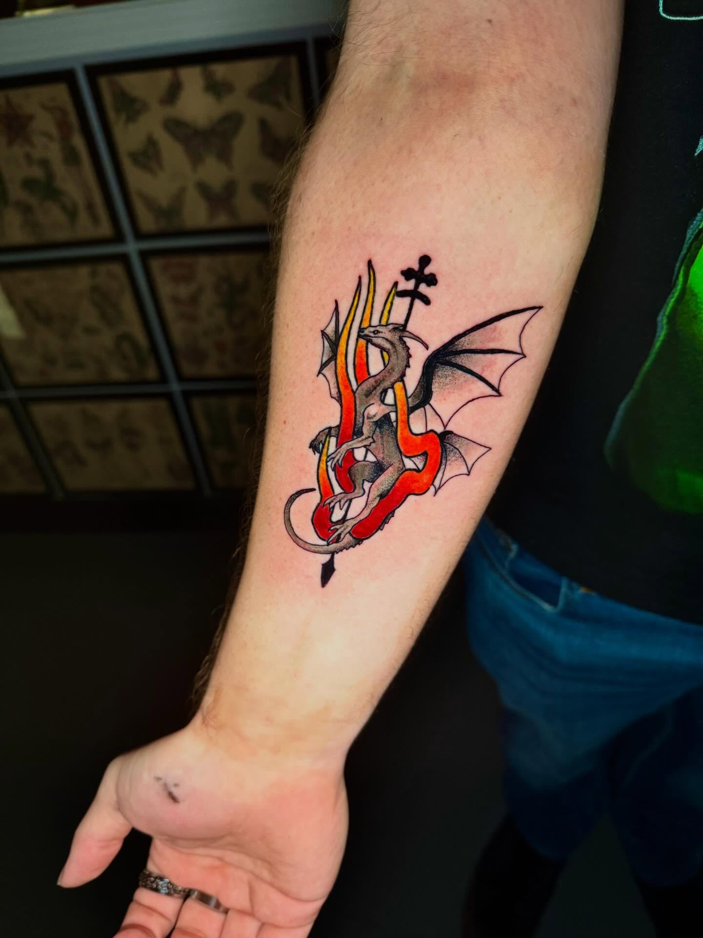 Dragon American traditional tattoo on the forearm by Mason McCubbin