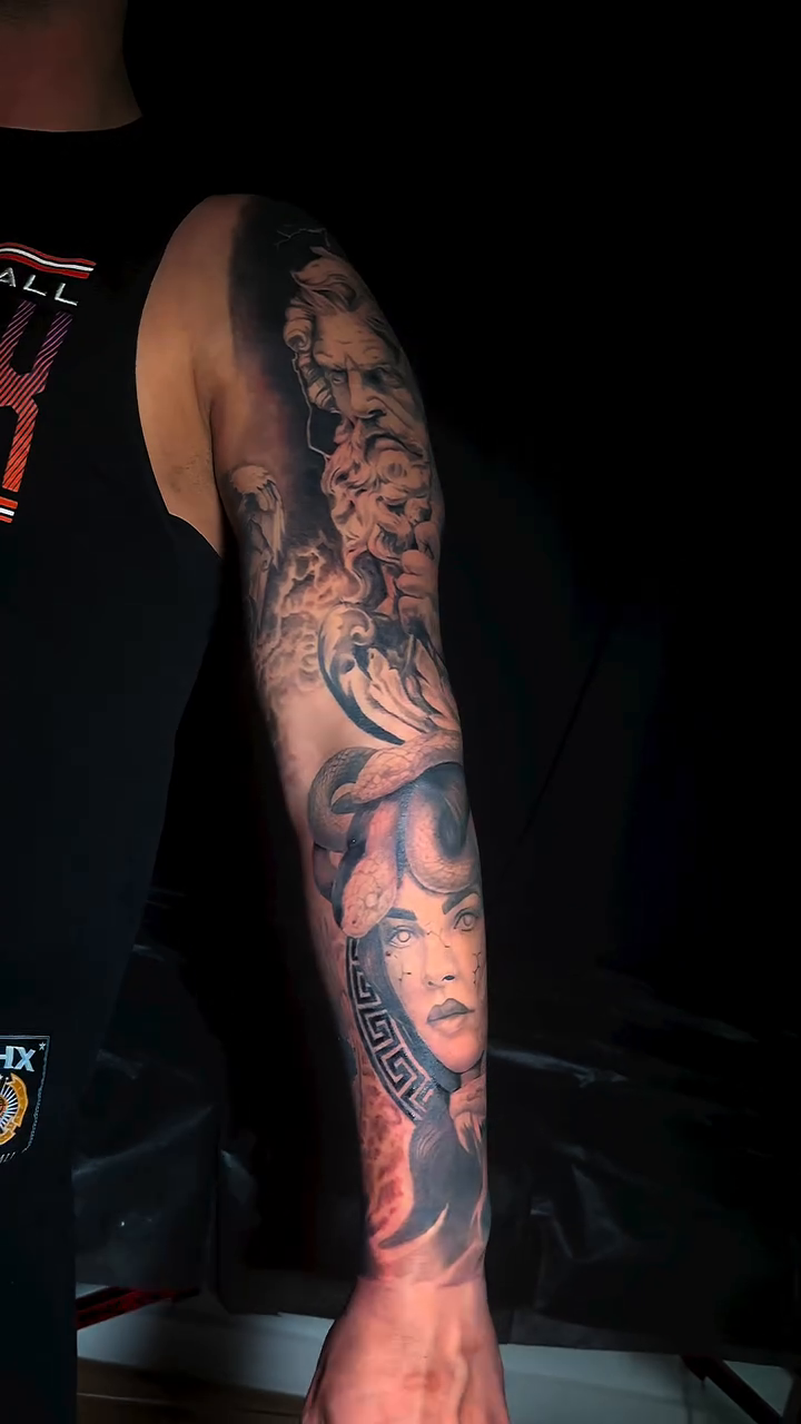 Realism tattoo on the upper arm by Dennis Alejandro