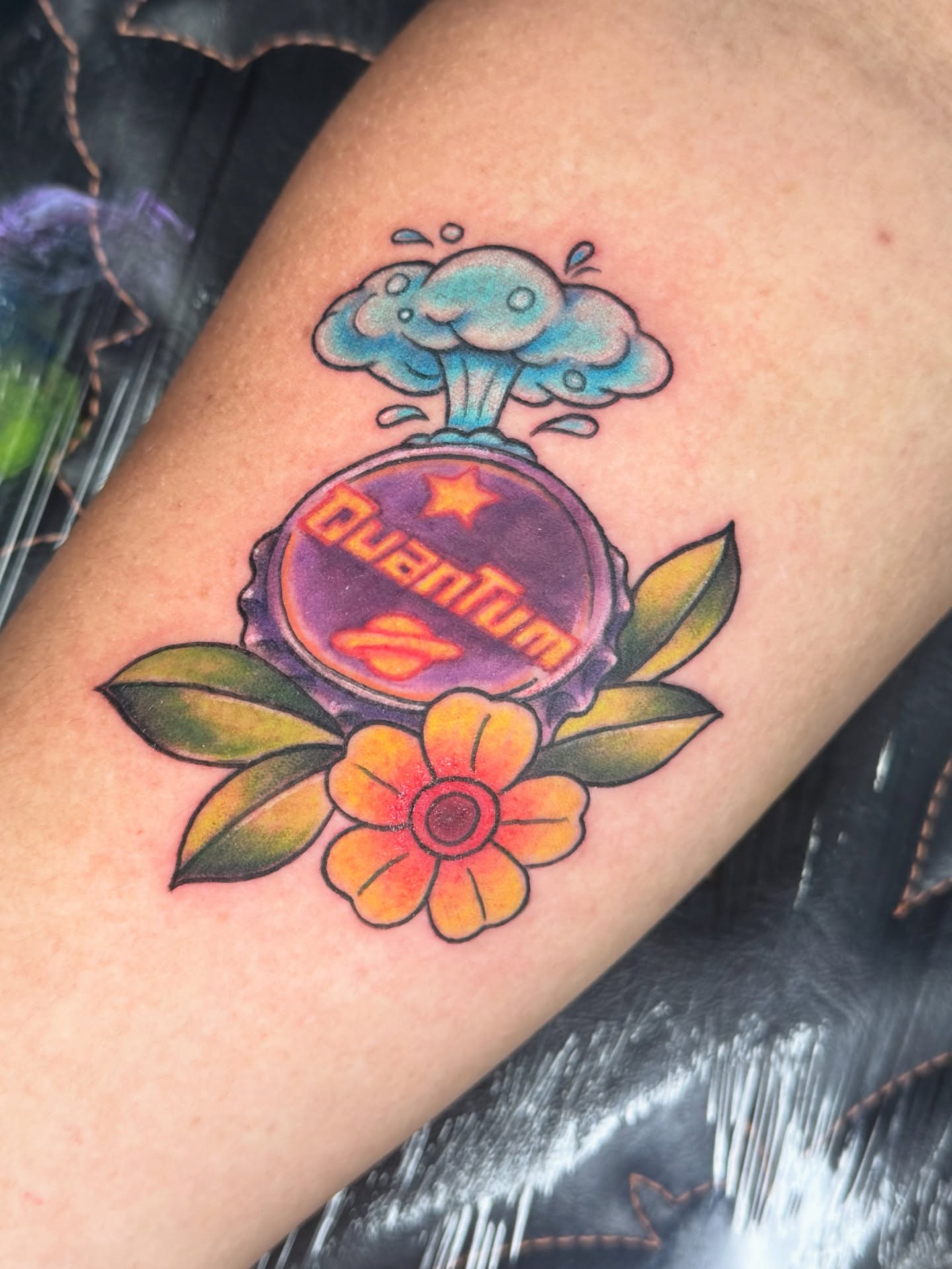 Atomic mushroom cloud and flower American traditional tattoo on the forearm by Breanna B