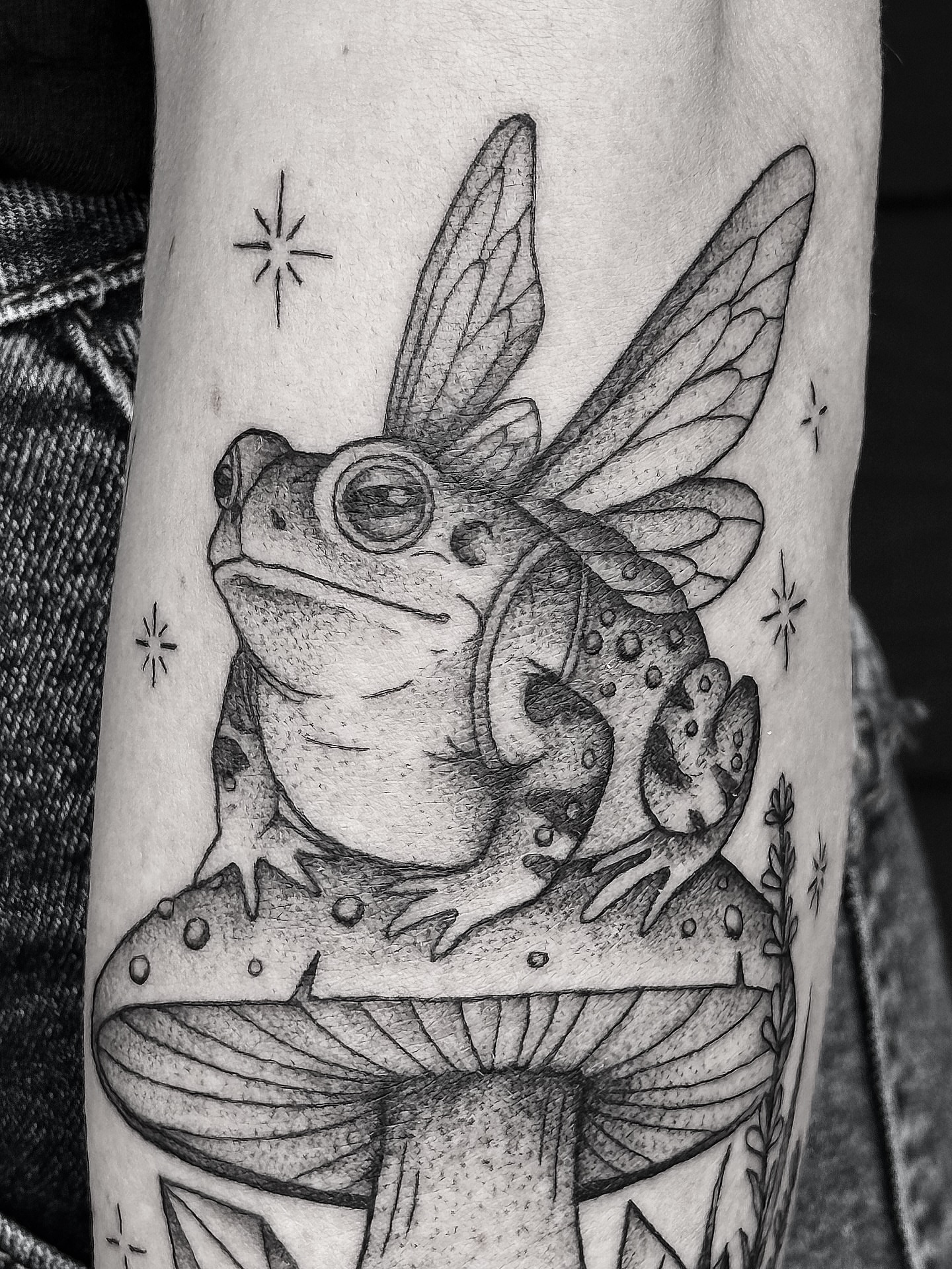 Frog with wings dotwork tattoo on the forearm by Breezy Tucker