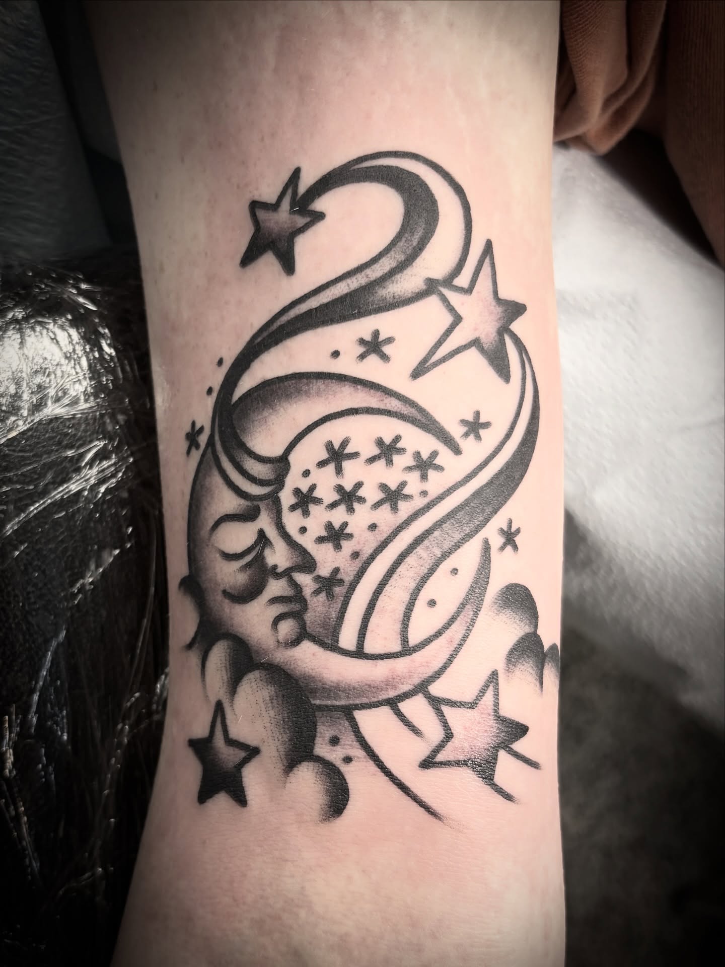 Moon and stars black and grey tattoo on the forearm by Deya Aven, Nashville, Tennessee