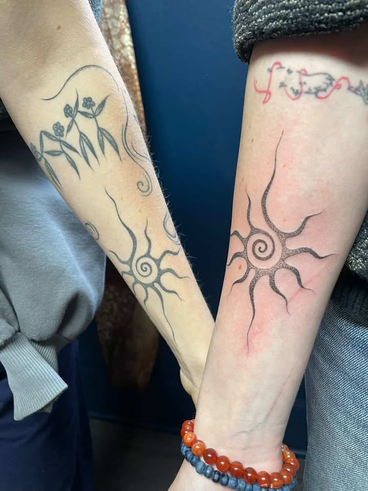 Sun dotwork tattoo on the forearm by Jesikah Rapp