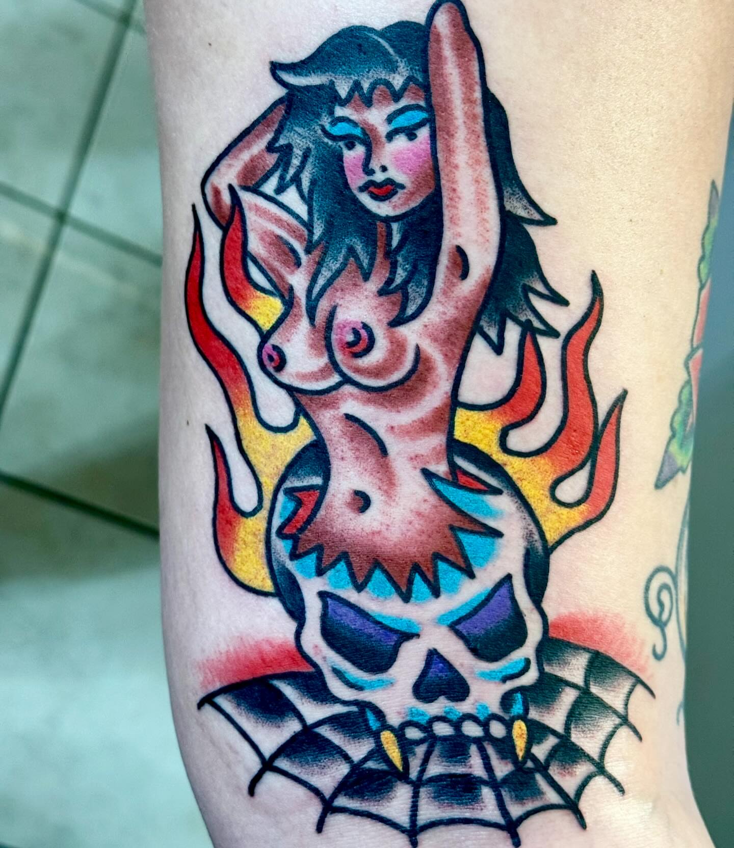 Mermaid with skull American traditional tattoo on the forearm by Sam Hambrick, Watchung NJ
