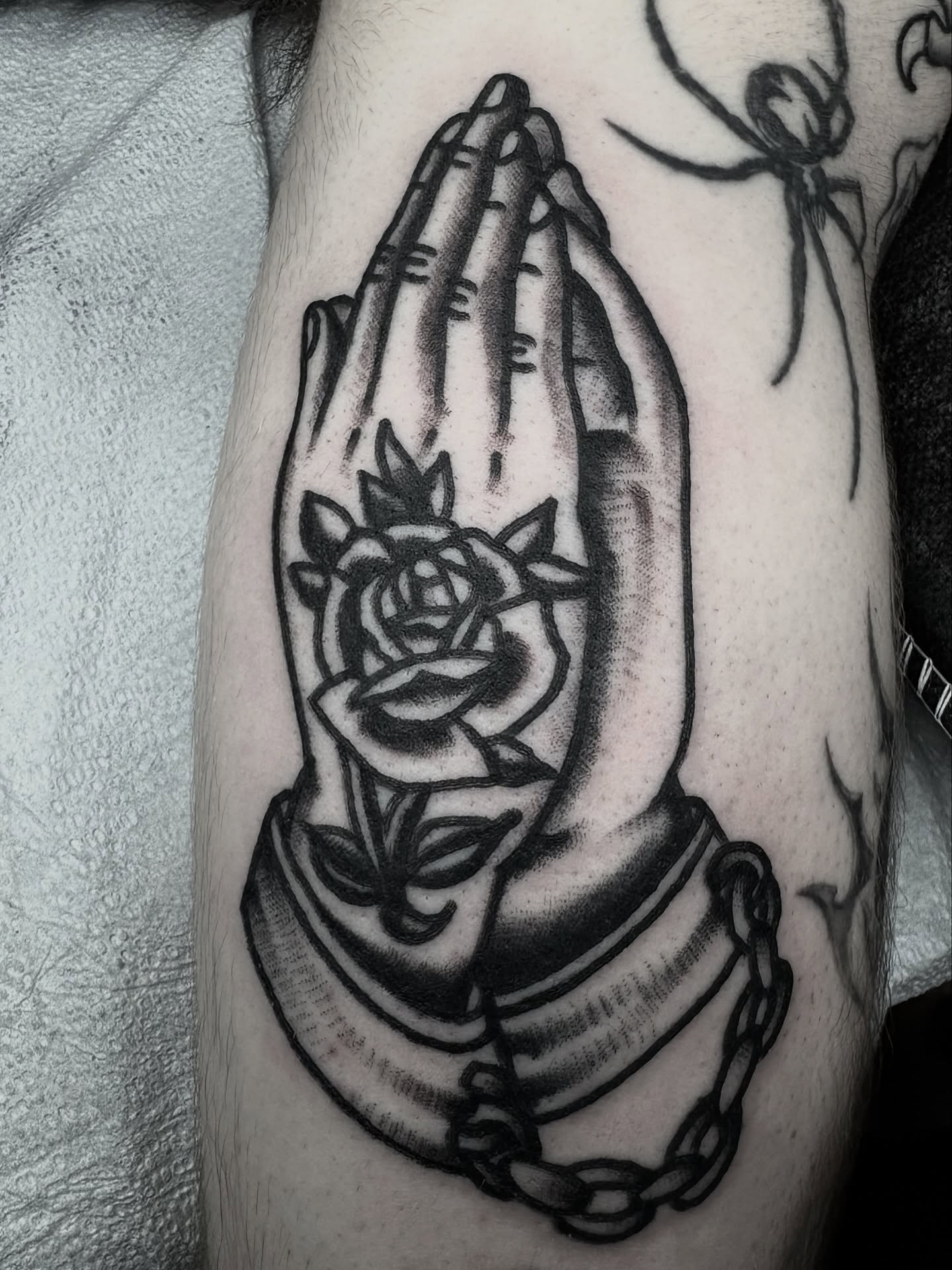 Praying hands with rose American traditional tattoo on the forearm by π³πππ πΆπππππ