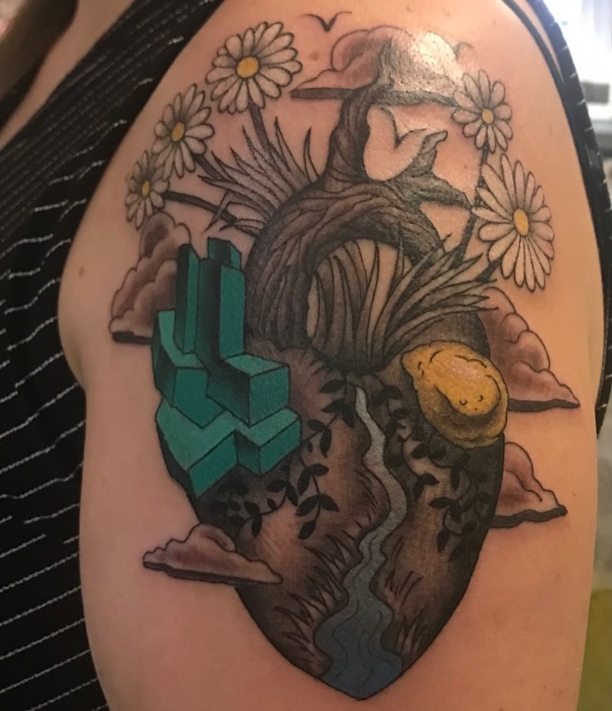 Heart with crystals geometric tattoo on the shoulder by Miles Maniaci, Chicago, Illinois