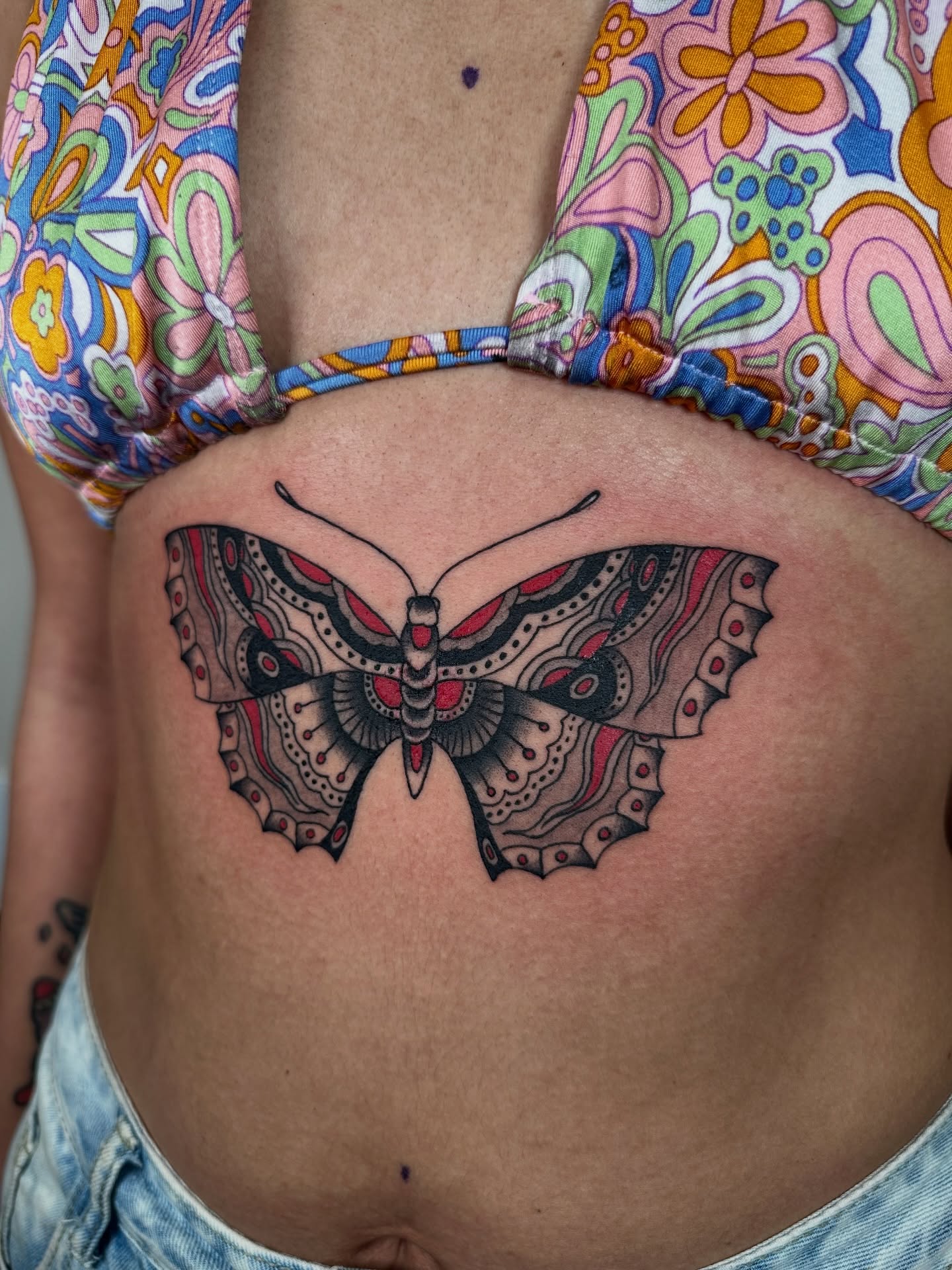 Butterfly ornamental tattoo on the torso by sechi