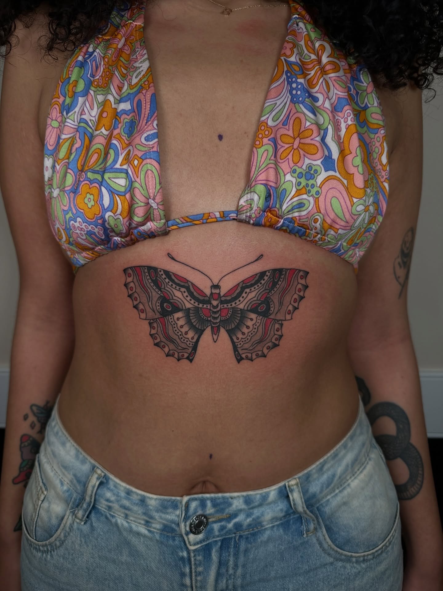 Butterfly geometric tattoo on the torso by sechi