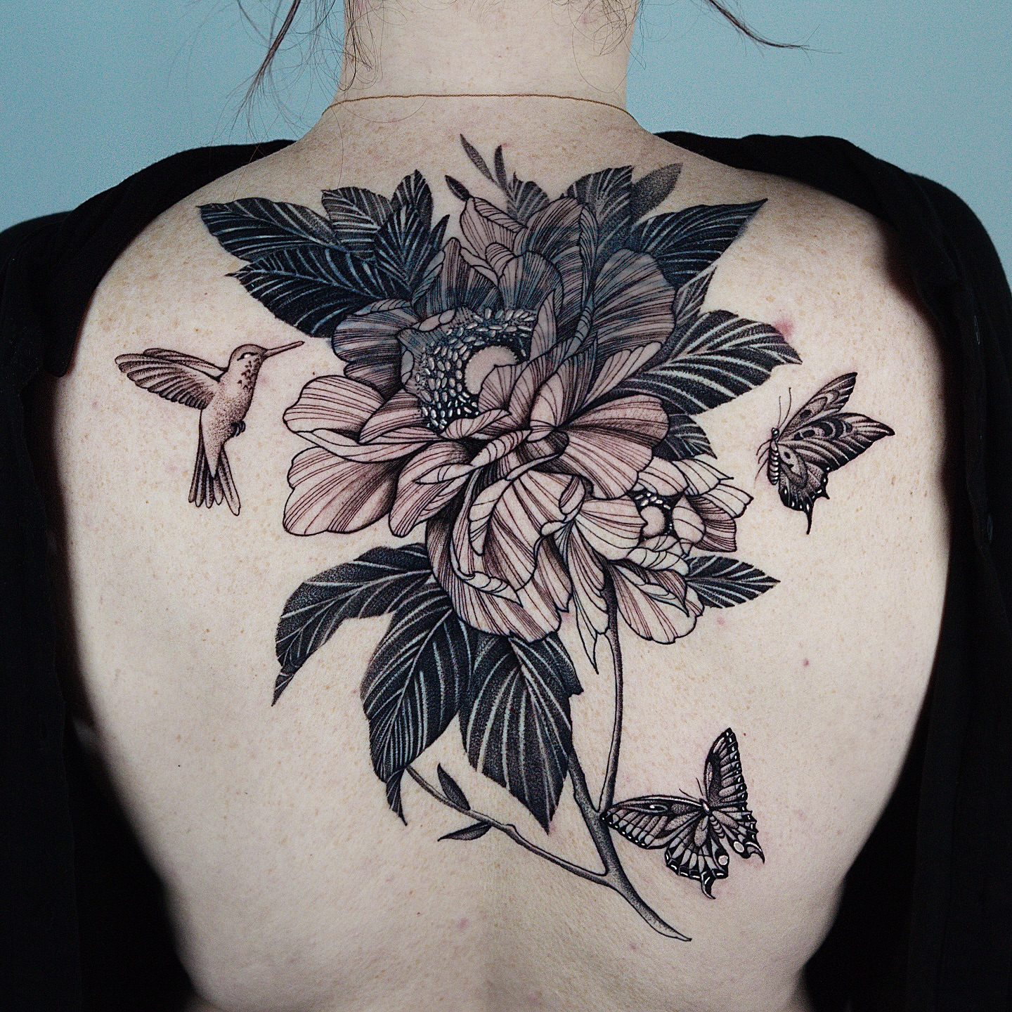 Flower and butterflies realism tattoo on the back by H I R A  L U P E - tattoo artist, Oakland, California