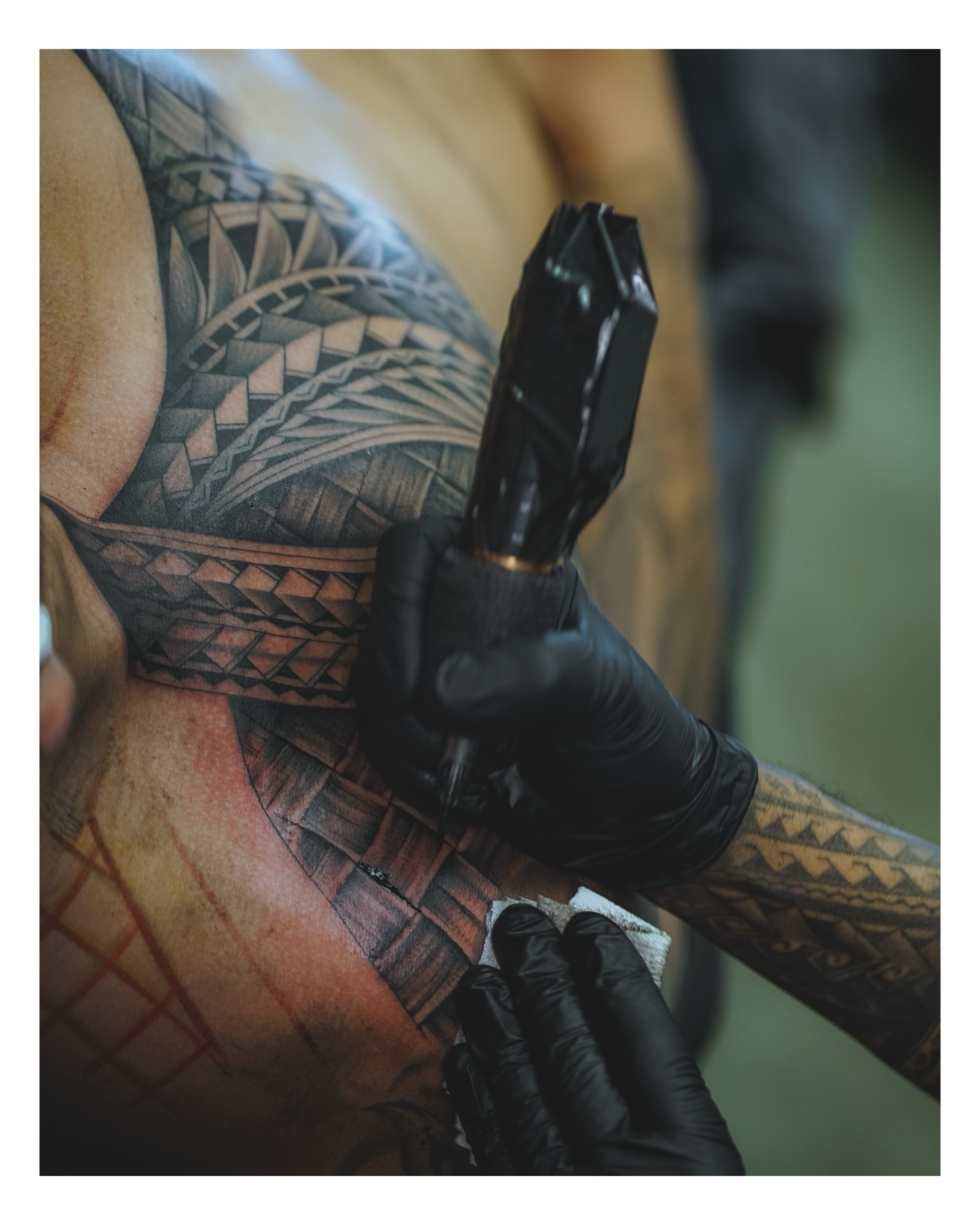 Tribal pattern tribal tattoo on the chest by TATTOOS by DESMOND